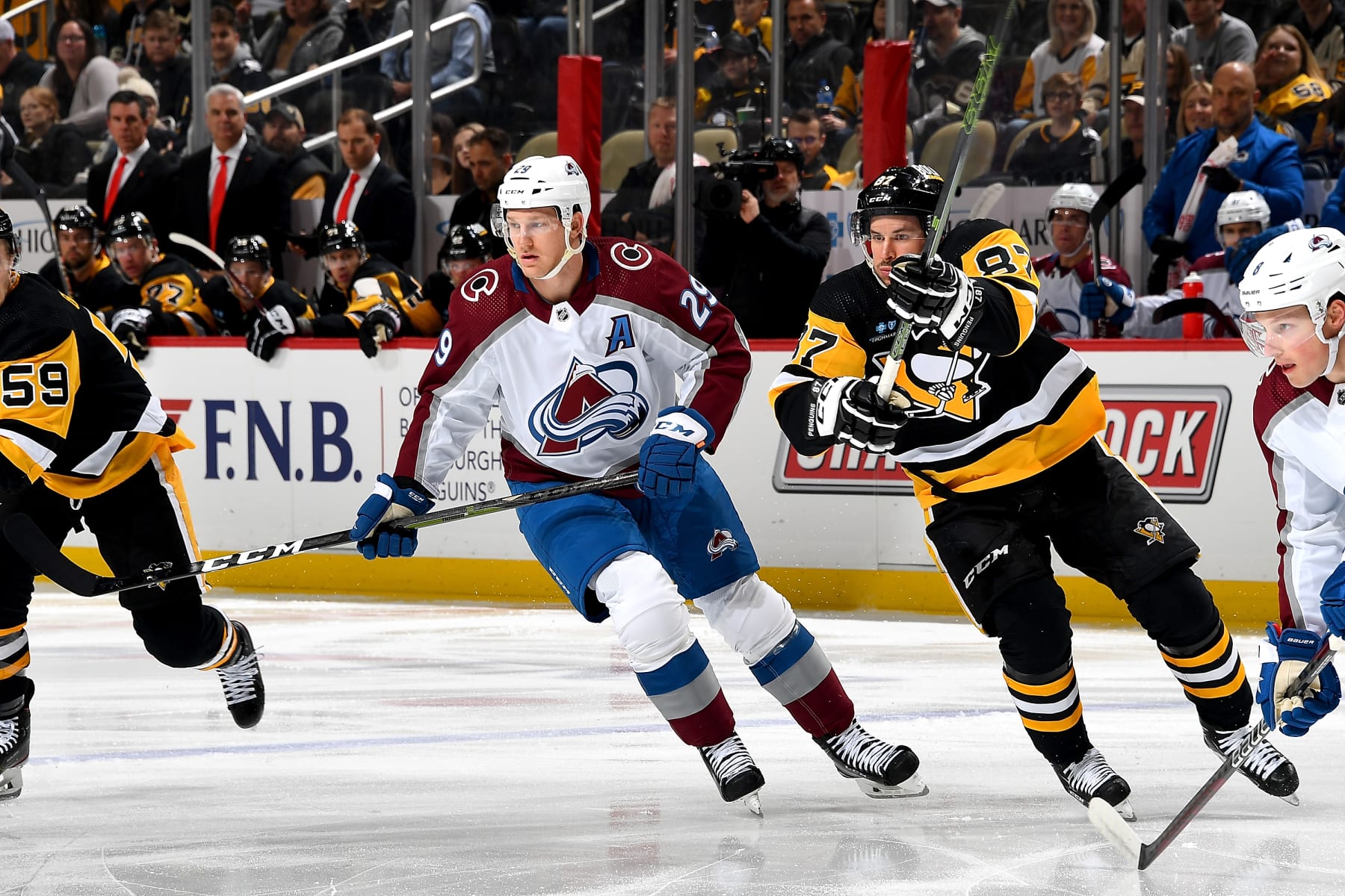 PITTSBURGH, PA - FEBRUARY 07:  Nathan MacKinnon #29 of the Colorado Avalanche and Sidney Crosby #87 of the Pittsburgh Penguins skate at PPG PAINTS Arena on February 7, 2023 in Pittsburgh, Pennsylvania. (Photo by Joe Sargent/NHLI via Getty Images)
