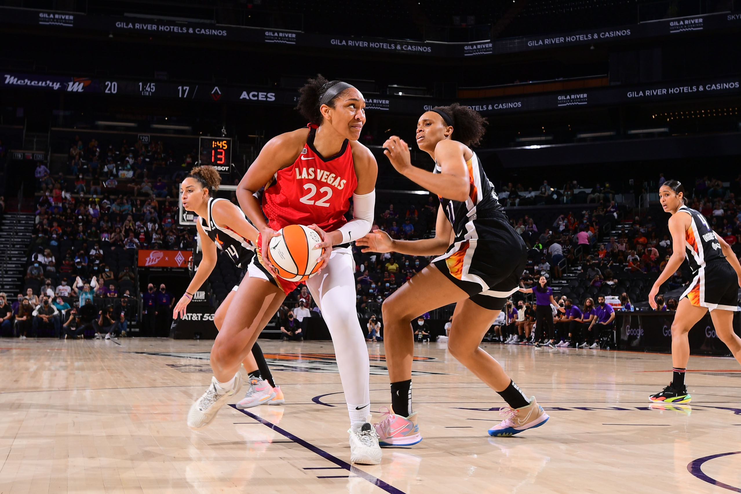 PHOENIX, AZ - SEPTEMBER 19: A'ja Wilson #22 of the Las Vegas Aces handles the ball during the game against the Phoenix Mercury on September 19, 2021 at Footprint Center in Phoenix, Arizona. NOTE TO USER: User expressly acknowledges and agrees that, by downloading and or using this photograph, user is consenting to the terms and conditions of the Getty Images License Agreement. Mandatory Copyright Notice: Copyright 2021 NBAE (Photo by Michael Gonzales/NBAE via Getty Images)