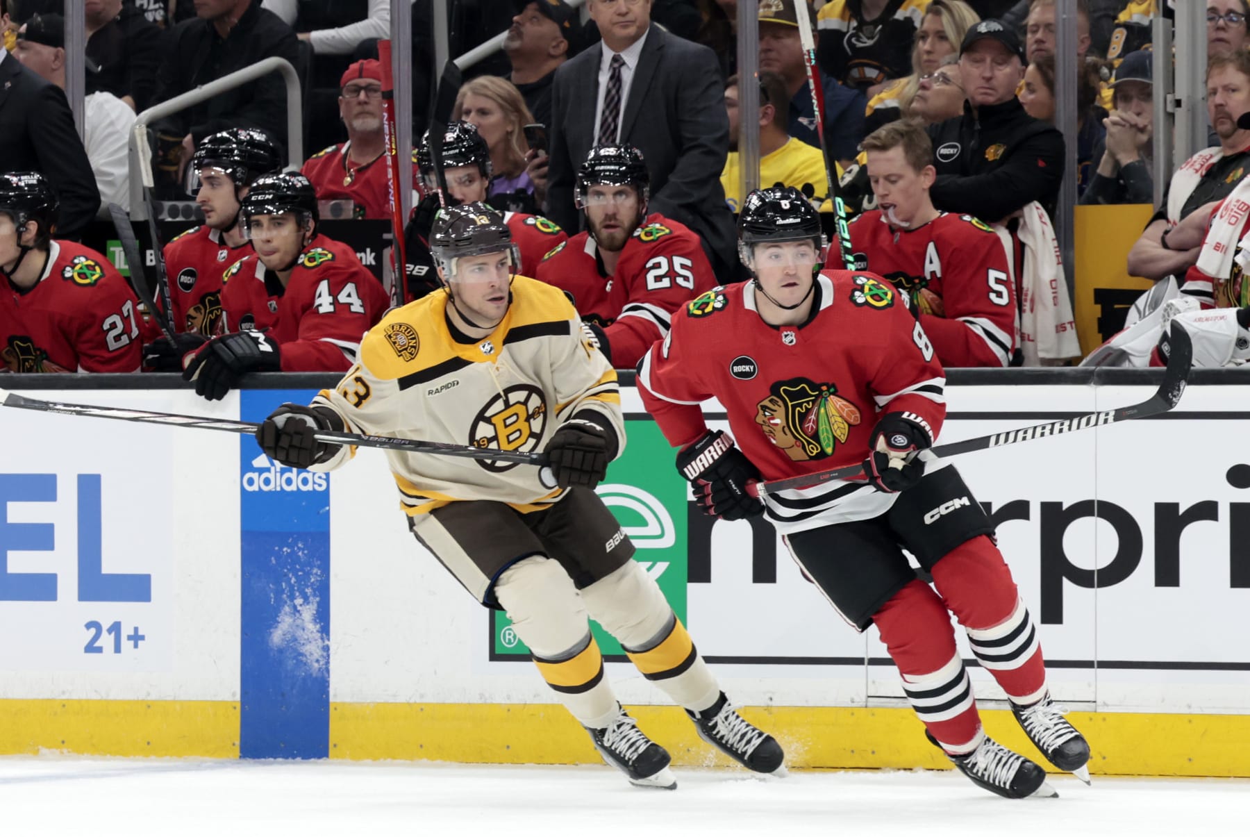 BOSTON, MA - OCTOBER 11: Boston Bruins center Charlie Coyle (13) sticks to Chicago Blackhawks winger Ryan Donato (8) during a game between the Boston Bruins and the Chicago Blackhawks on October 11, 2023, at TD Garden in Boston, Massachusetts. (Photo by Fred Kfoury III/Icon Sportswire via Getty Images)
