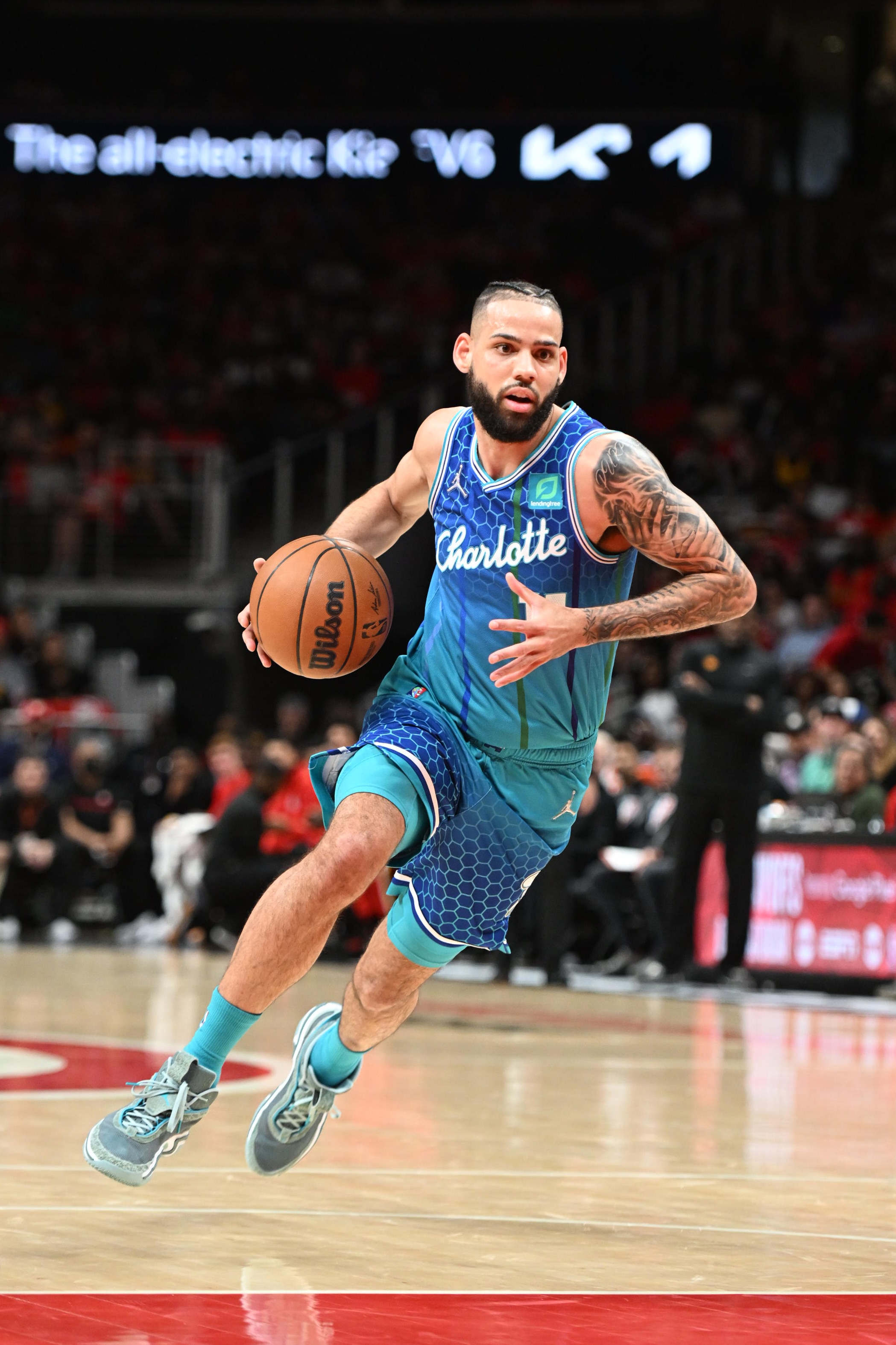 ATLANTA, GA - APRIL 13: Cody Martin #11 of the Charlotte Hornets drives to the basket against the Atlanta Hawks during the 2022 Play-In Tournament on April 13, 2022 at State Farm Arena in Atlanta, Georgia.  NOTE TO USER: User expressly acknowledges and agrees that, by downloading and/or using this Photograph, user is consenting to the terms and conditions of the Getty Images License Agreement. Mandatory Copyright Notice: Copyright 2022 NBAE (Photo by Adam Hagy/NBAE via Getty Images)