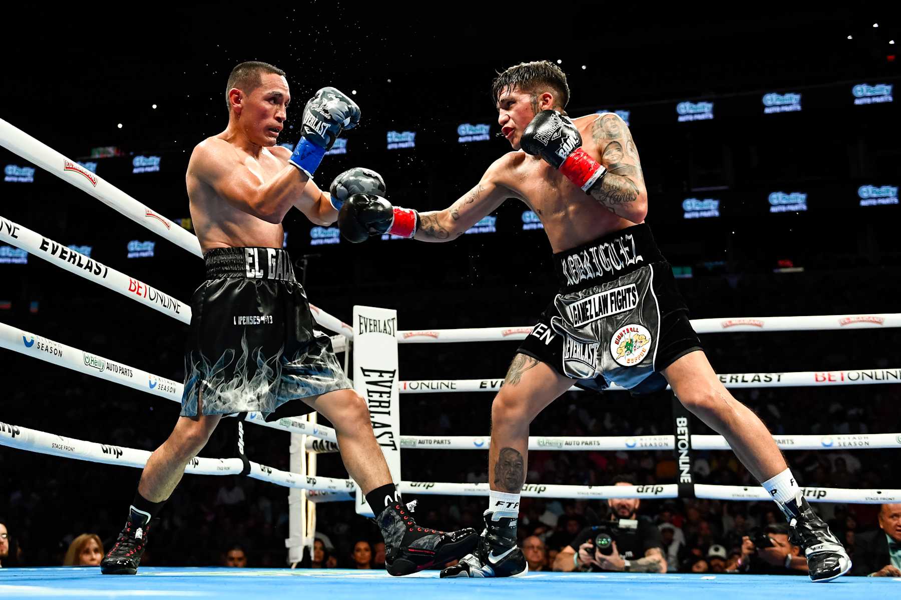 PHOENIX, ARIZONA - JUNE 29: Juan Francisco Estrada (L) of Mexico and Jesse ‘Bam’ Rodriguez (R) of the United States fight during their WBC world and Ring Magazine super flyweight title bout at Footprint Center on June 29, 2024 in Phoenix, Arizona. (Photo by Kelsey Grant/Getty Images)