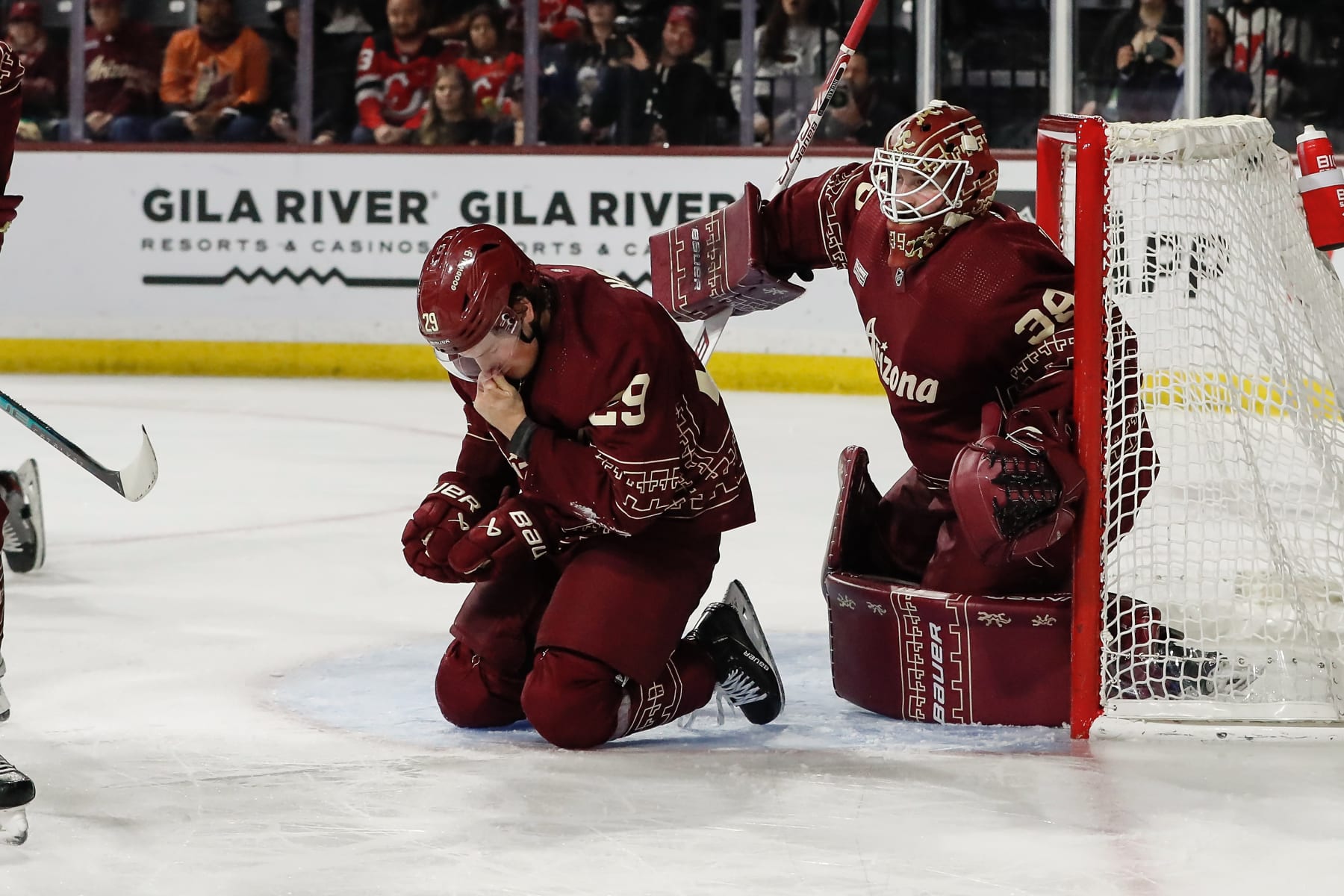 TEMPE, AZ - MARCH 05:  Arizona Coyotes center Barrett Hayton (29) kneels on the ice after getting hit in the face by a high stick during the NHL hockey game between the New Jersey Devils and the Arizona Coyotes on March 5, 2023 at Mullet Arena in Tempe, Arizona. (Photo by Kevin Abele/Icon Sportswire via Getty Images)