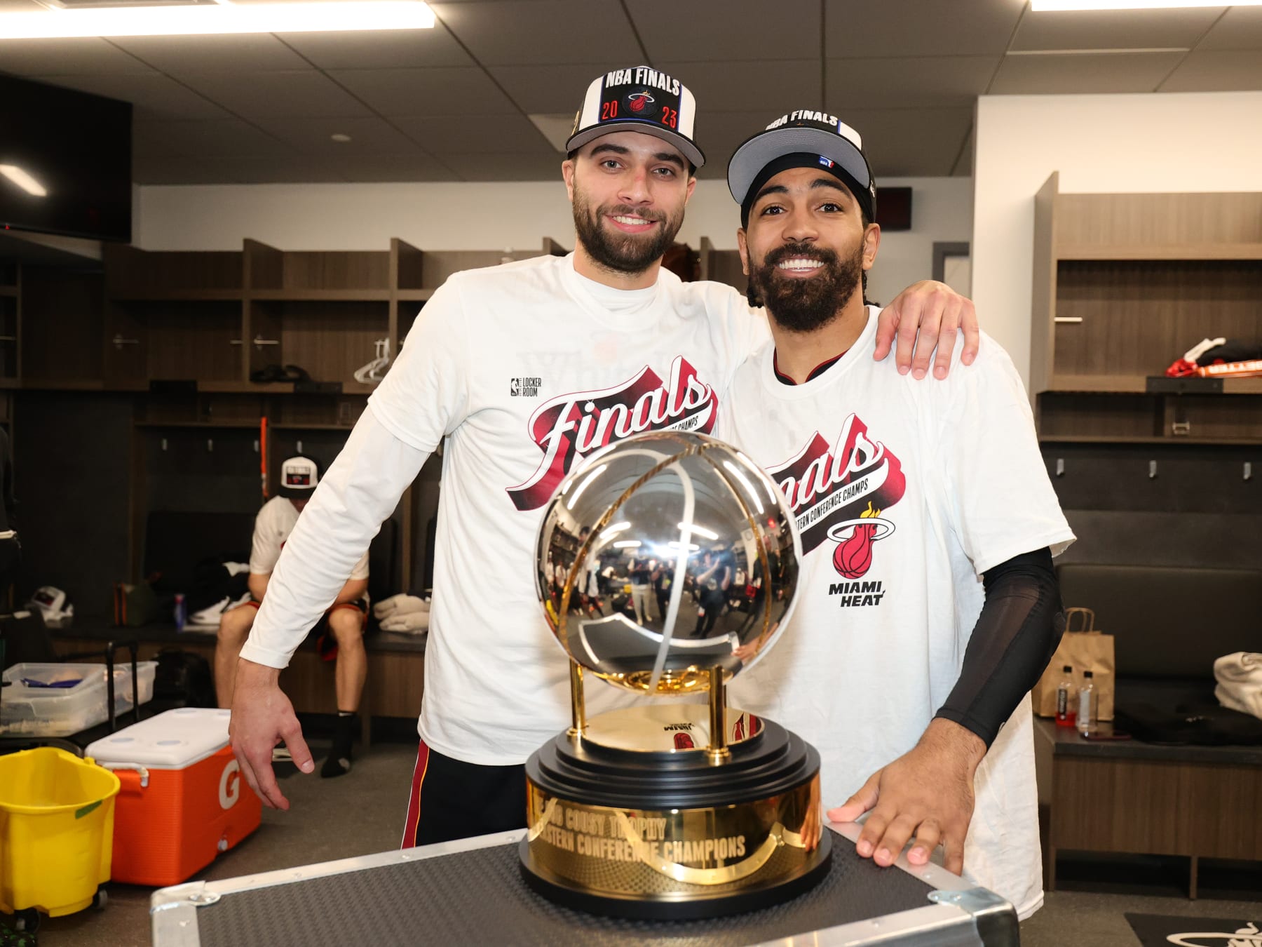 BOSTON, MA - MAY 29: Max Strus #31 and Gabe Vincent #2 of the Miami Heat in the locker room with the Bob Cousy Trophy after defeating the Boston Celtics during Game Seven of the Eastern Conference Finals on May 29, 2023 at the TD Garden in Boston, Massachusetts. NOTE TO USER: User expressly acknowledges and agrees that, by downloading and or using this photograph, User is consenting to the terms and conditions of the Getty Images License Agreement. Mandatory Copyright Notice: Copyright 2023 NBAE  (Photo by Nathaniel S. Butler/NBAE via Getty Images)