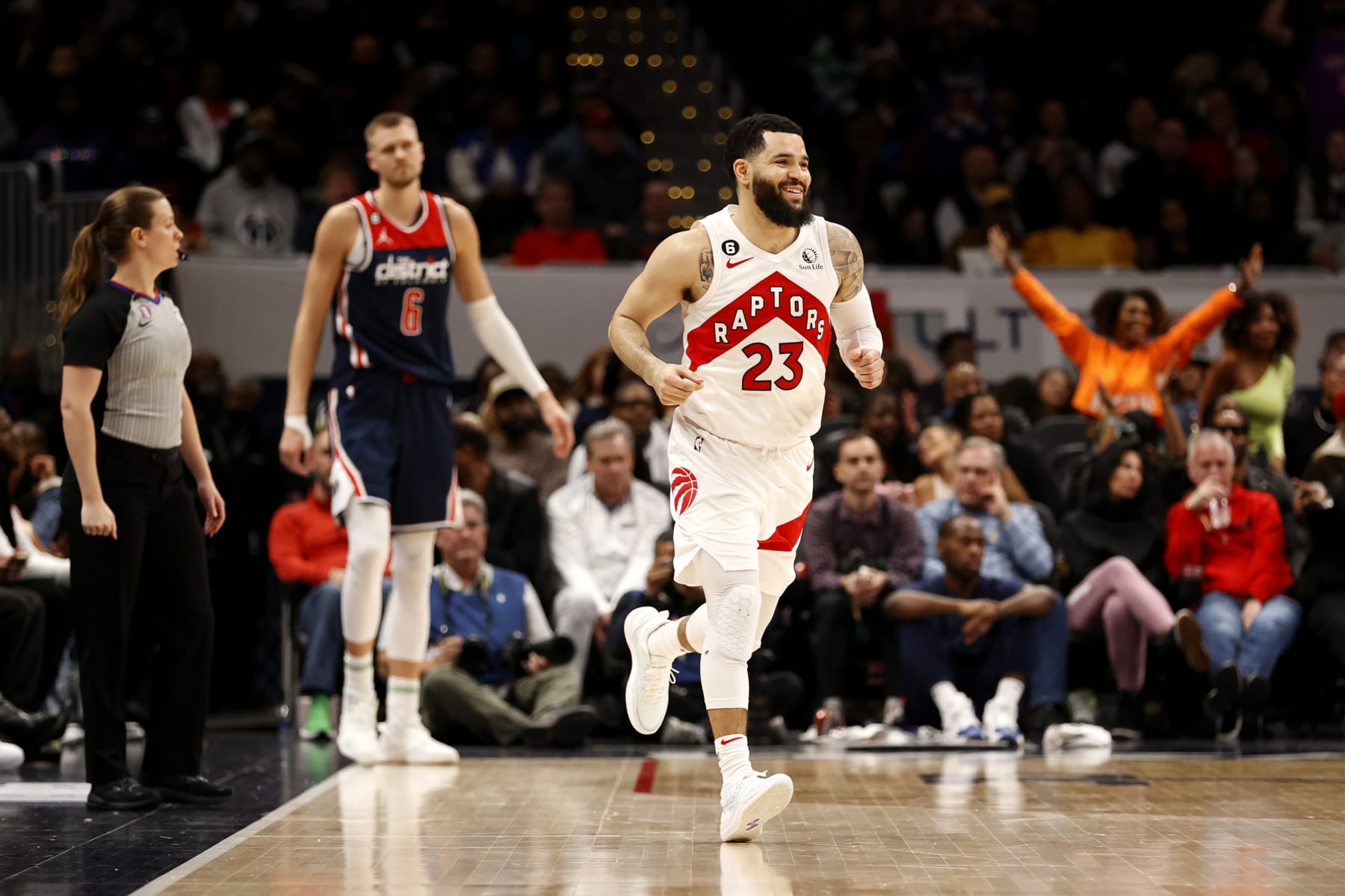 WASHINGTON, DC - MARCH 04: Fred VanVleet #23 of the Toronto Raptors celebrates in front of Kristaps Porzingis #6 of the Washington Wizards after hitting a three pointer in overtime at Capital One Arena on March 04, 2023 in Washington, DC. NOTE TO USER: User expressly acknowledges and agrees that, by downloading and or using this photograph, User is consenting to the terms and conditions of the Getty Images License Agreement. (Photo by Rob Carr/Getty Images)