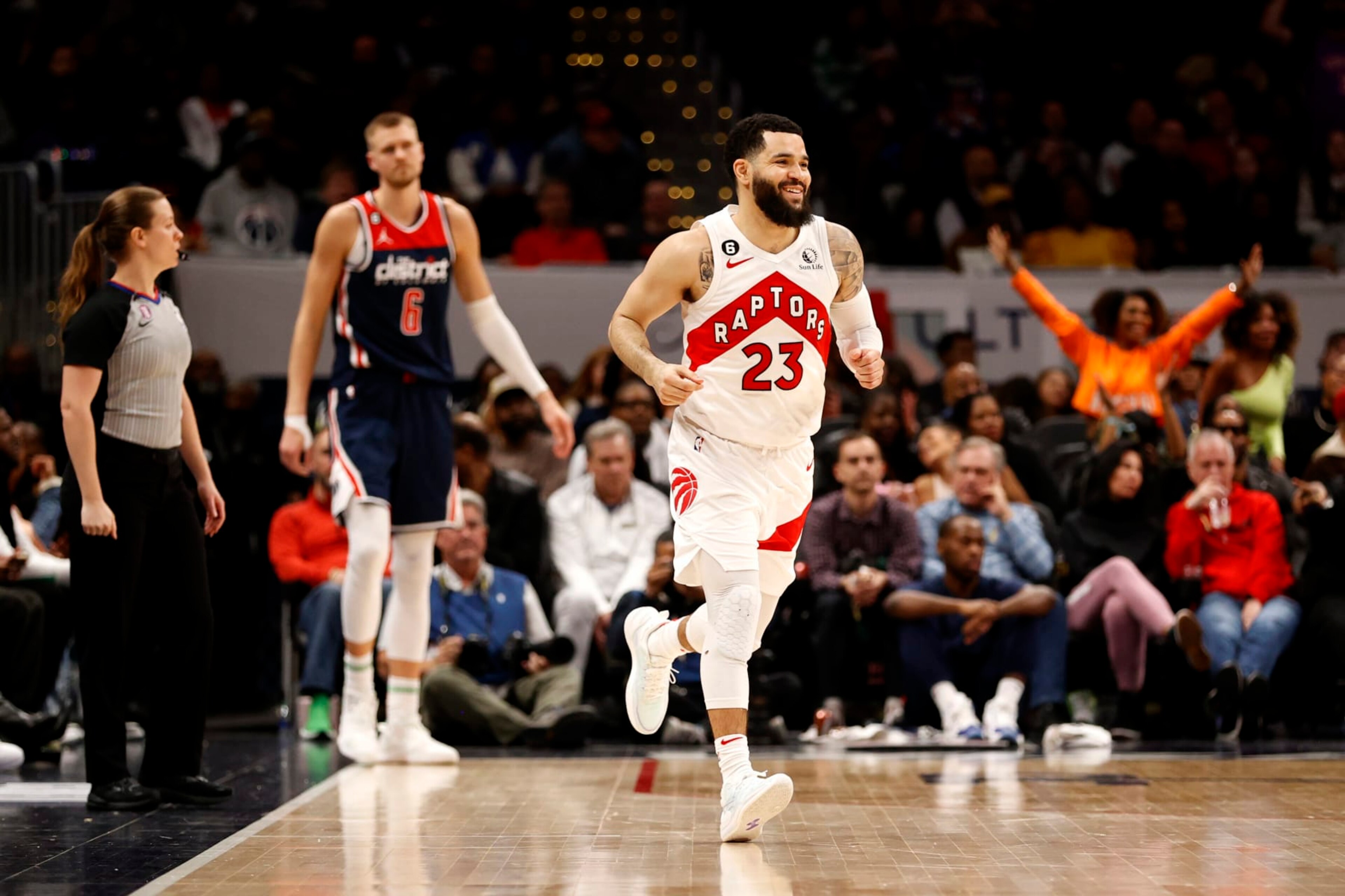 WASHINGTON, DC - MARCH 04: Fred VanVleet #23 of the Toronto Raptors celebrates in front of Kristaps Porzingis #6 of the Washington Wizards after hitting a three pointer in overtime at Capital One Arena on March 04, 2023 in Washington, DC. NOTE TO USER: User expressly acknowledges and agrees that, by downloading and or using this photograph, User is consenting to the terms and conditions of the Getty Images License Agreement. (Photo by Rob Carr/Getty Images)