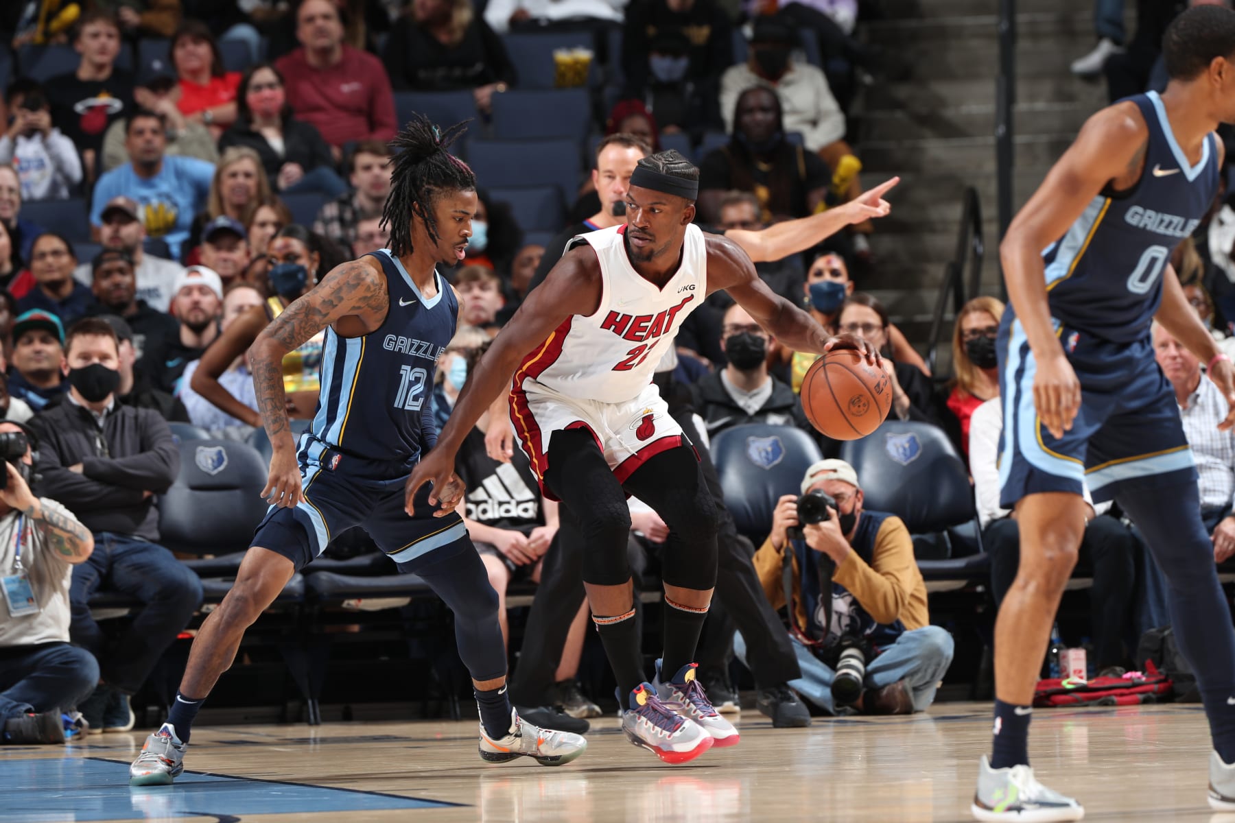 MEMPHIS, TN - OCTOBER 30: Jimmy Butler #22 of the Miami Heat dribbles the ball against Ja Morant #12 of the Memphis Grizzlies on October 30, 2021 at FedExForum in Memphis, Tennessee. NOTE TO USER: User expressly acknowledges and agrees that, by downloading and or using this photograph, User is consenting to the terms and conditions of the Getty Images License Agreement. Mandatory Copyright Notice: Copyright 2021 NBAE (Photo by Joe Murphy/NBAE via Getty Images)