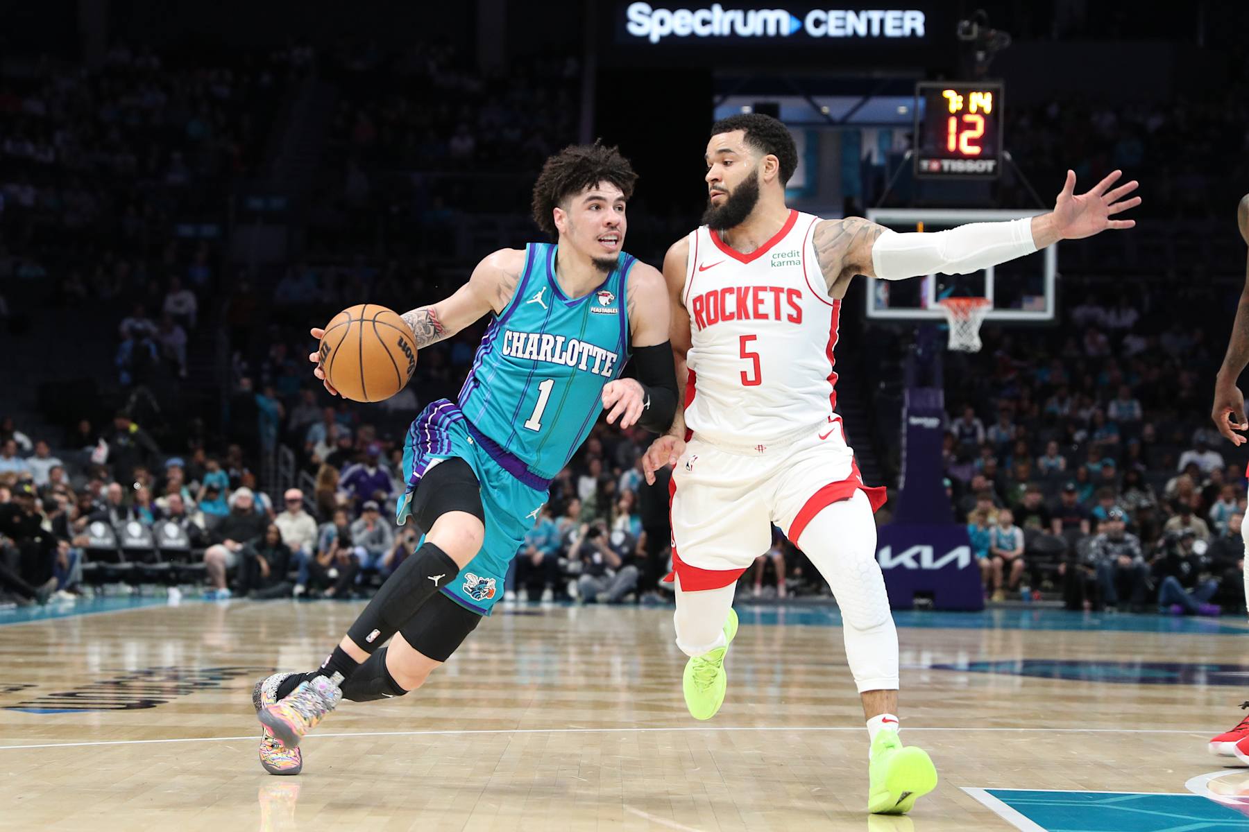 CHARLOTTE, NC - JANUARY 26:  LaMelo Ball #1 of the Charlotte Hornets drives to the basket during the game as Fred VanVleet #5 of the Houston Rockets plays defense on January 26, 2024 at Spectrum Center in Charlotte, North Carolina. NOTE TO USER: User expressly acknowledges and agrees that, by downloading and or using this photograph, User is consenting to the terms and conditions of the Getty Images License Agreement.  Mandatory Copyright Notice:  Copyright 2024 NBAE (Photo by Brock Williams-Smith/NBAE via Getty Images)