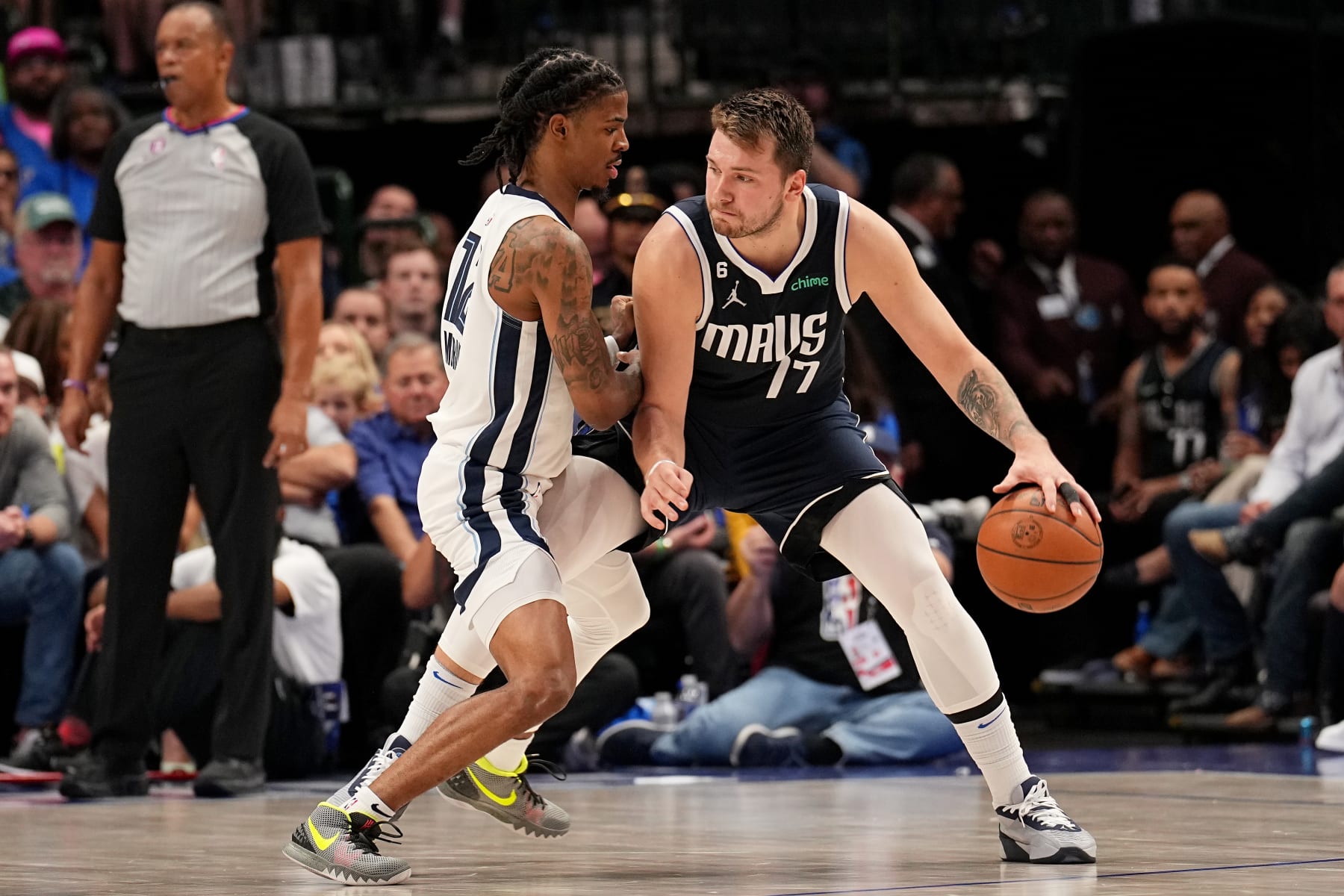 DALLAS, TX - OCTOBER 22: Ja Morant #12 of the Memphis Grizzlies plays defense against Luka Doncic #77 of the Dallas Mavericks on October 22, 2022 at the American Airlines Center in Dallas, Texas. NOTE TO USER: User expressly acknowledges and agrees that, by downloading and or using this photograph, User is consenting to the terms and conditions of the Getty Images License Agreement. Mandatory Copyright Notice: Copyright 2022 NBAE (Photo by Glenn James/NBAE via Getty Images)