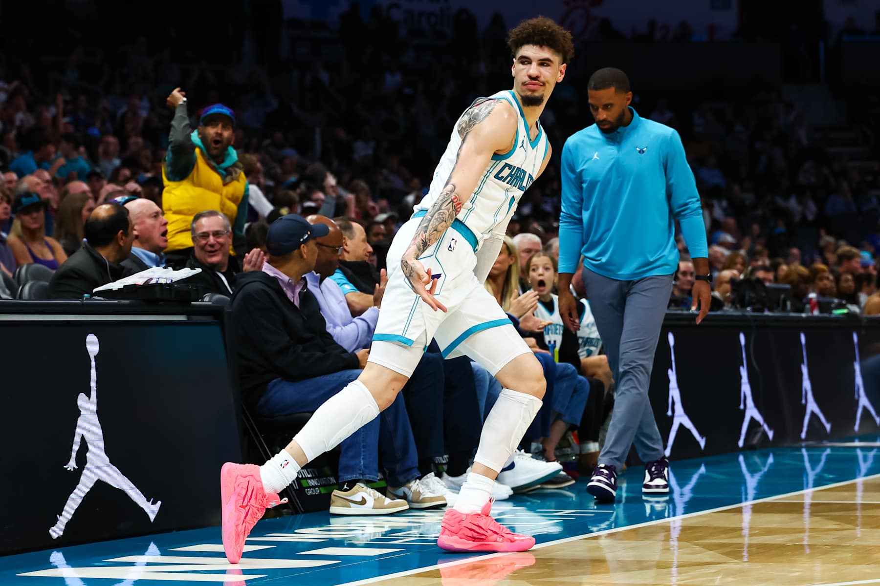 CHARLOTTE, NORTH CAROLINA - NOVEMBER 25: LaMelo Ball #1 of the Charlotte Hornets reacts after making a three pointer during the first half of a basketball game against the Orlando Magic at Spectrum Center on November 25, 2024 in Charlotte, North Carolina. NOTE TO USER: User expressly acknowledges and agrees that, by downloading and or using this photograph, User is consenting to the terms and conditions of the Getty Images License Agreement. (Photo by David Jensen/Getty Images)