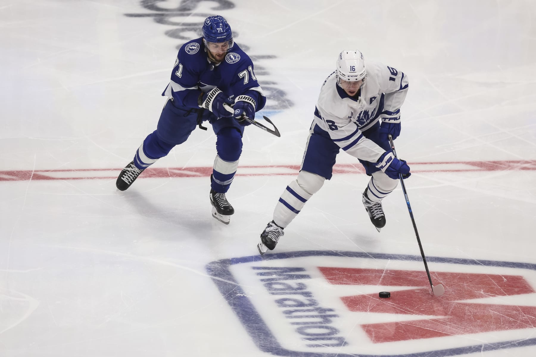 Tampa Bay Lightning's Anthony Cirelli, left, and Toronto Maple Leafs' Mitch Marner.