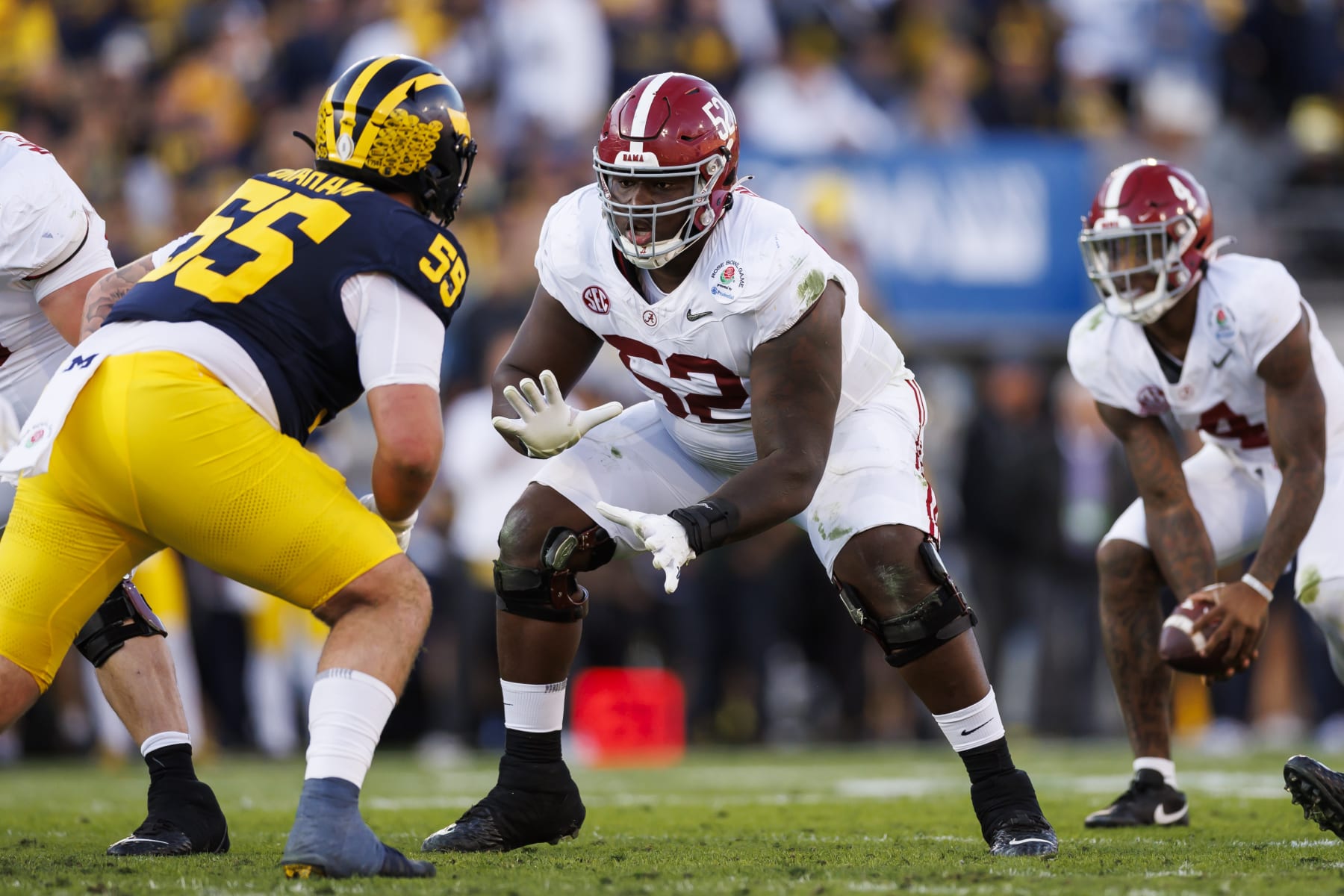 PASADENA, CALIFORNIA - JANUARY 01: Offensive lineman Tyler Booker #52 of the Alabama Crimson Tide blocks during the CFP Semifinal Rose Bowl Game against the Michigan Wolverines at Rose Bowl Stadium on January 1, 2024 in Pasadena, California. (Photo by Ryan Kang/Getty Images)