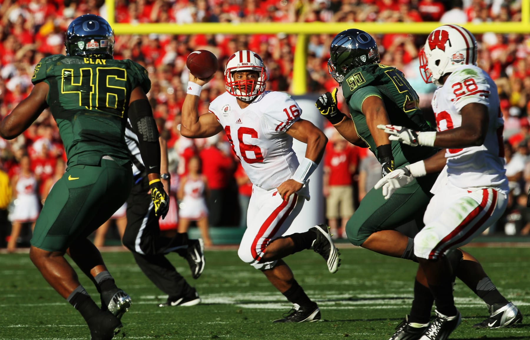 PASADENA, CA - JANUARY 02:  Quarterback Russell Wilson #16 of the Wisconsin Badgers looks to pass in the first quarter against the Oregon Ducks at the 98th Rose Bowl Game on January 2, 2012 in Pasadena, California.  (Photo by Stephen Dunn/Getty Images)