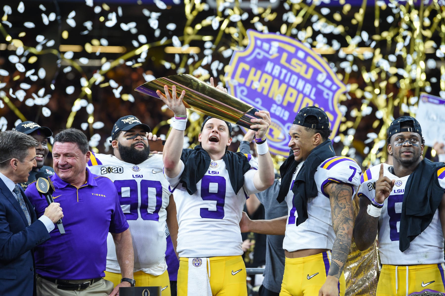 NEW ORLEANS, LA - JANUARY 13: LSU Tigers quarterback Joe Burrow (9) hoists the trophy high after winning the CFP National Championship game between the LSU Tigers and Clemson Tigers at the Mercedes-Benz Superdome on January 13, 2020 in New Orleans, LA. (Photo by Ken Murray/Icon Sportswire via Getty Images) NEW ORLEANS, LA - JANUARY 13: LSU Tigers quarterback Joe Burrow (9) hoists the trophy high after winning the CFP National Championship game between the LSU Tigers and Clemson Tigers at the Mercedes-Benz Superdome on January 13, 2020 in New Orleans, LA. (Photo by Ken Murray/Icon Sportswire via Getty Images)
