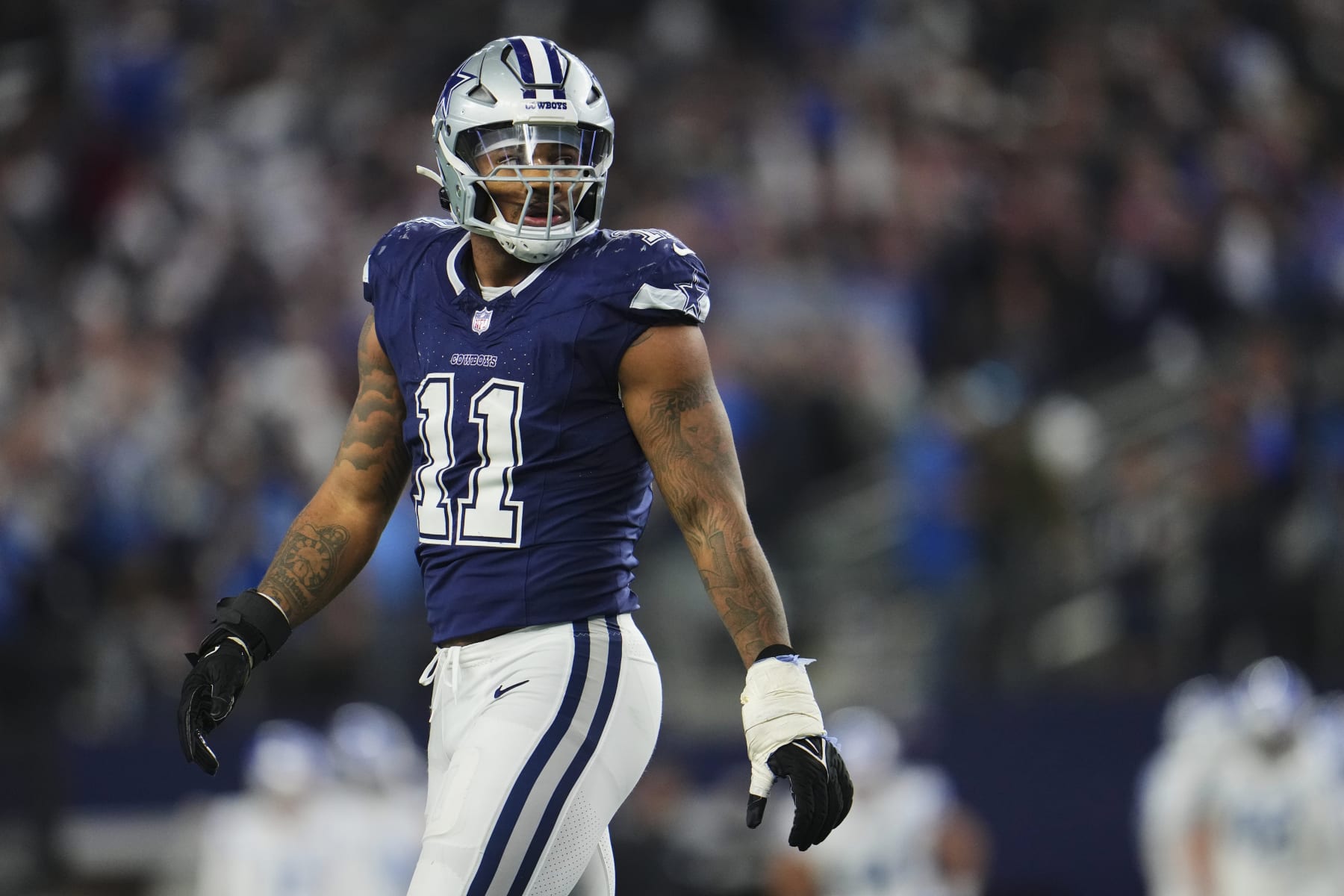ARLINGTON, TX - DECEMBER 30: Micah Parsons #11 of the Dallas Cowboys jogs off the field against the Detroit Lions during the second half at AT&T Stadium on December 30, 2023 in Arlington, Texas. (Photo by Cooper Neill/Getty Images)