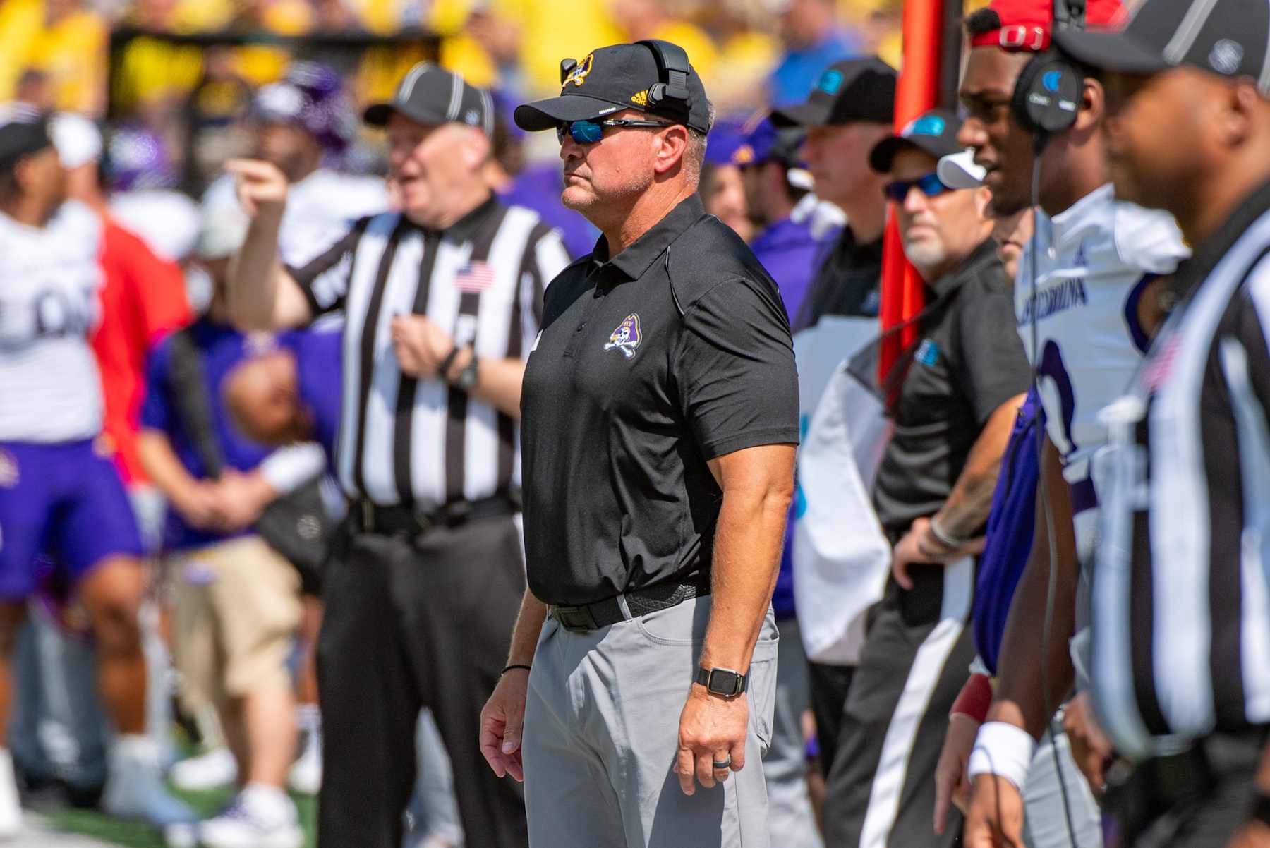 ANN ARBOR, MICHIGAN - SEPTEMBER 02: Head Football Coach Mike Houston of the East Carolina Pirates watches a play from the sideline during the first half of a college football game against the Michigan Wolverines at Michigan Stadium on September 02, 2023 in Ann Arbor, Michigan. (Photo by Aaron J. Thornton/Getty Images)