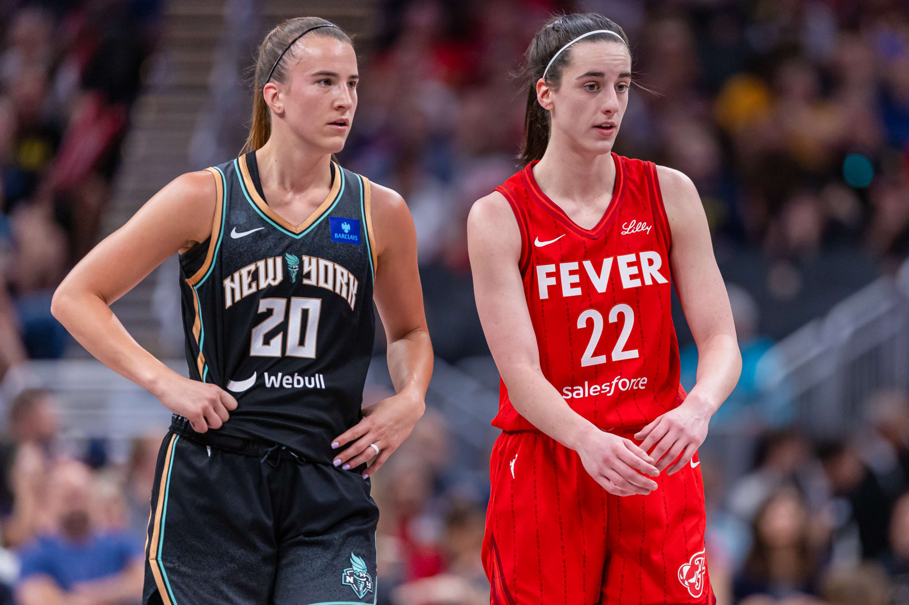 INDIANAPOLIS, INDIANA - JULY 6: Caitlin Clark #22 of the Indiana Fever and Sabrina Ionescu #20 of the New York Liberty talk during the game at Gainbridge Fieldhouse on July 6, 2024 in Indianapolis, Indiana. NOTE TO USER: User expressly acknowledges and agrees that, by downloading and or using this photograph, User is consenting to the terms and conditions of the Getty Images License Agreement. (Photo by Michael Hickey/Getty Images)
