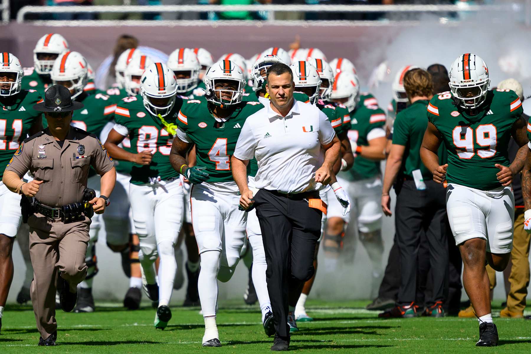 MIAMI GARDENS, FL - NOVEMBER 23: Miami head coach Mario Cristobal leads the team onto the field before the college football game between the Wake Forest Deacon Demons and the University of Miami Hurricanes on November 23, 2024 at the Hard Rock Stadium in Miami Gardens, FL. (Photo by Doug Murray/Icon Sportswire via Getty Images)