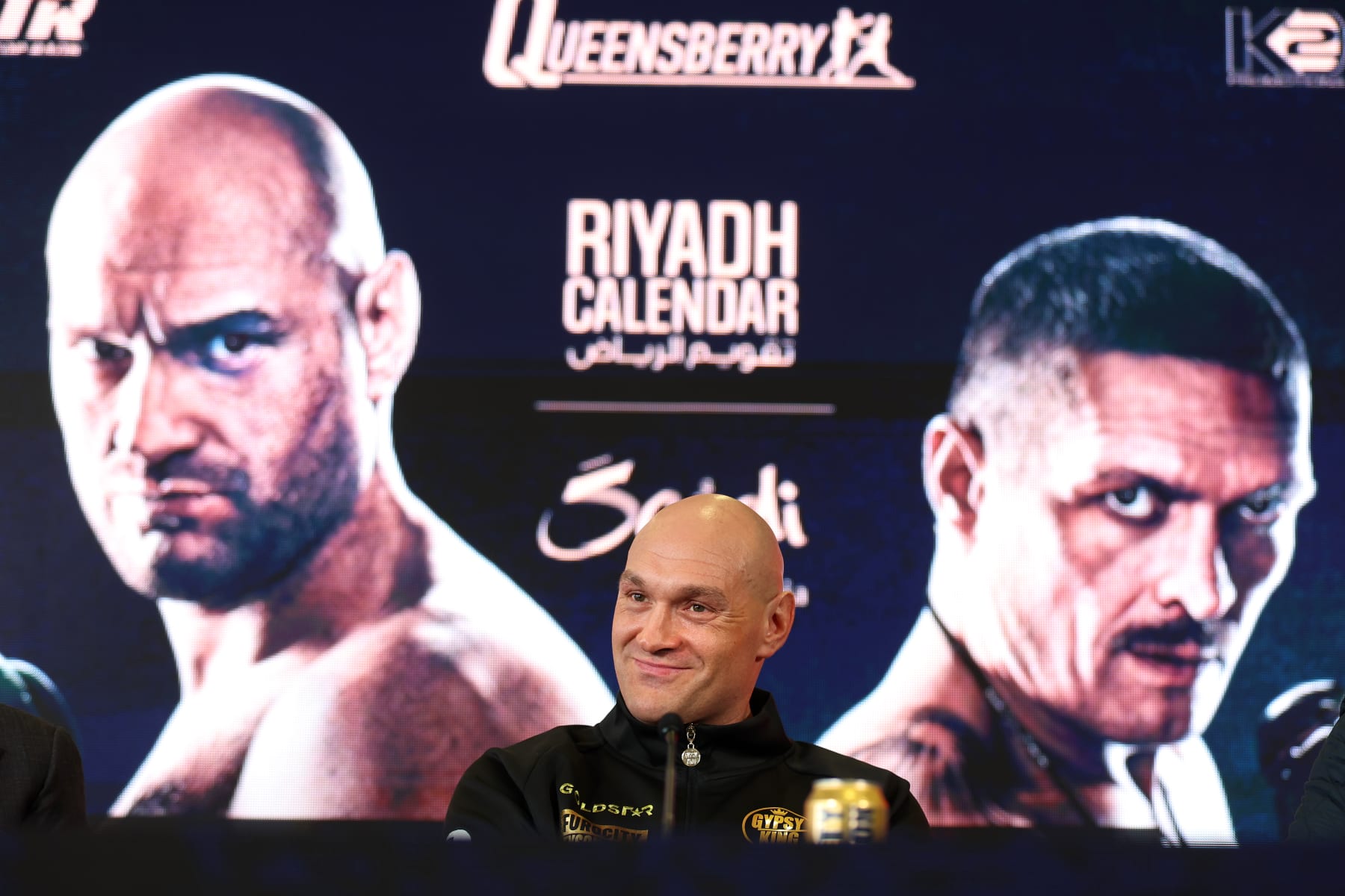 MORECAMBE, ENGLAND - APRIL 10: Tyson Fury smiles during a press conference ahead of the IBF, IBO, WBA, WBO and WBC Undisputed World Heavyweight title fight against Oleksandr Usyk on the 'Ring of Fire' card at Mazuma Stadium on April 10, 2024 in Morecambe, England.  (Photo by Nathan Stirk/Getty Images)