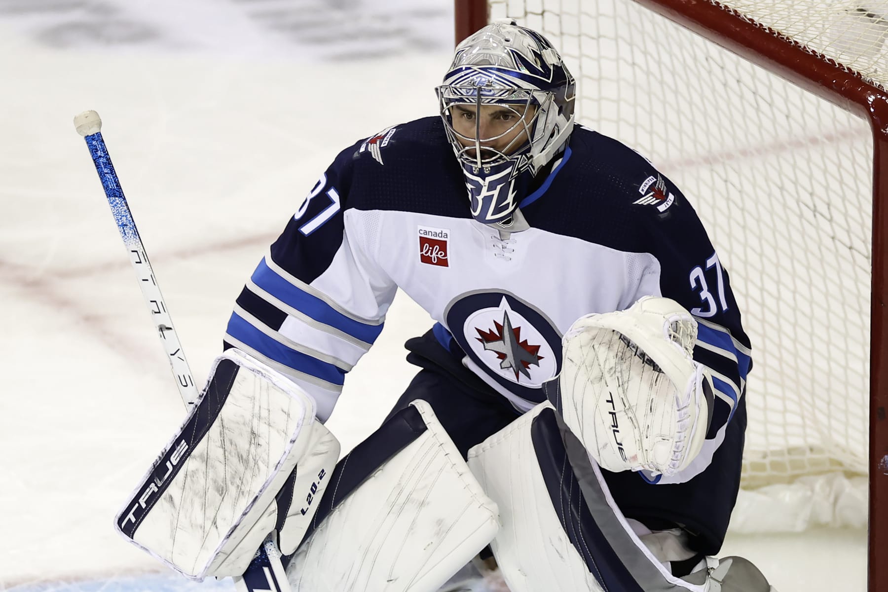 Winnipeg Jets goaltender Connor Hellebuyck (37) defends against the New York Rangers in the third period of an NHL hockey game Monday, Feb. 20, 2023, in New York. The Jets won 4-1. (AP Photo/Adam Hunger)