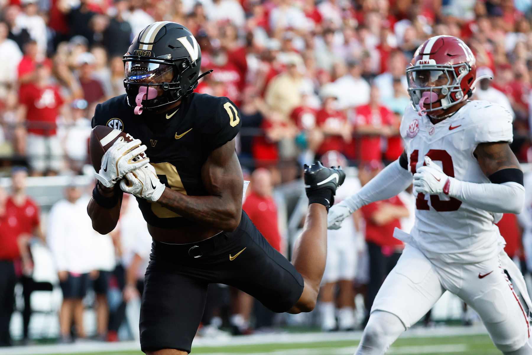 Vanderbilt Commodores wide receiver Junior Sherrill (0) makes a touchdown catch in front of Alabama Crimson Tide defensive back Malachi Moore