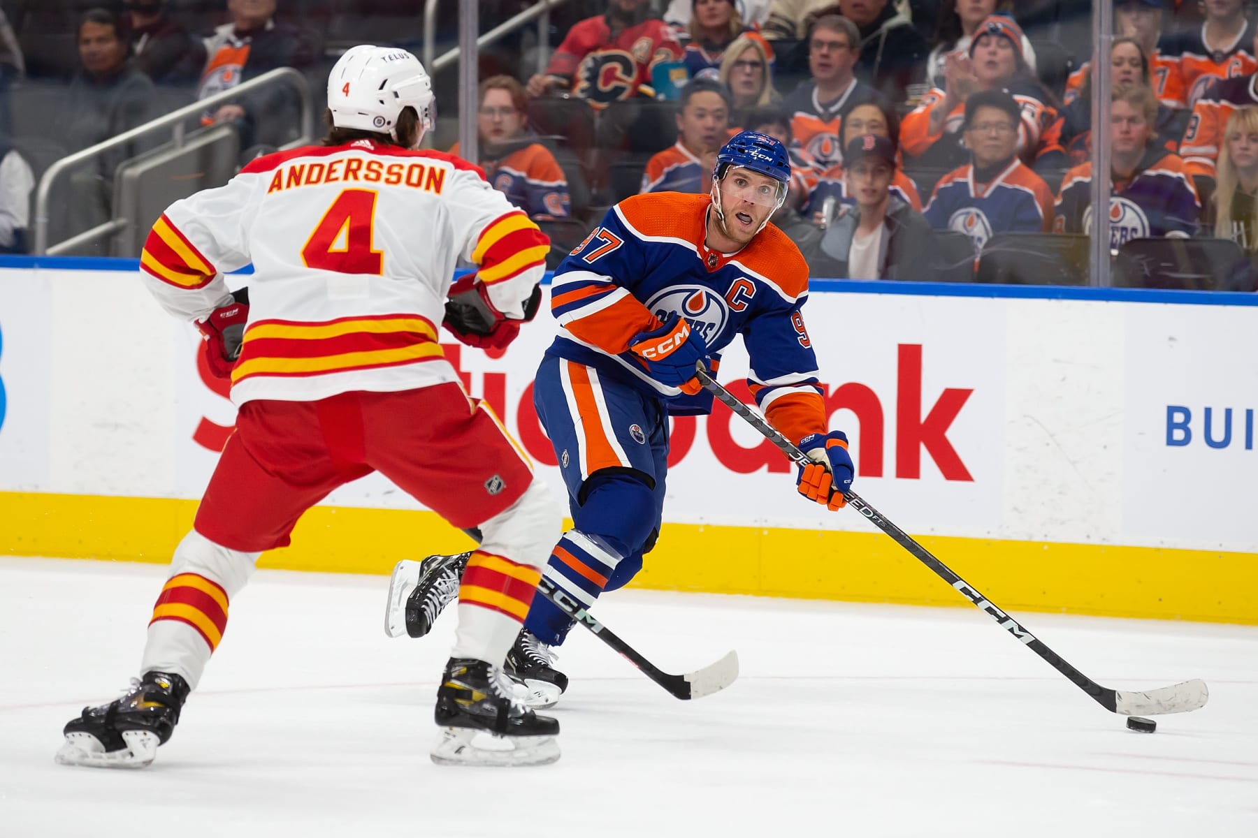 EDMONTON, AB - OCTOBER 15: Connor McDavid #97 of the Edmonton Oilers skates in against Rasmus Andersson #4 of the Calgary Flames during the second period at Rogers Place on October 15, 2022 in Edmonton, Canada. (Photo by Codie McLachlan/Getty Images)