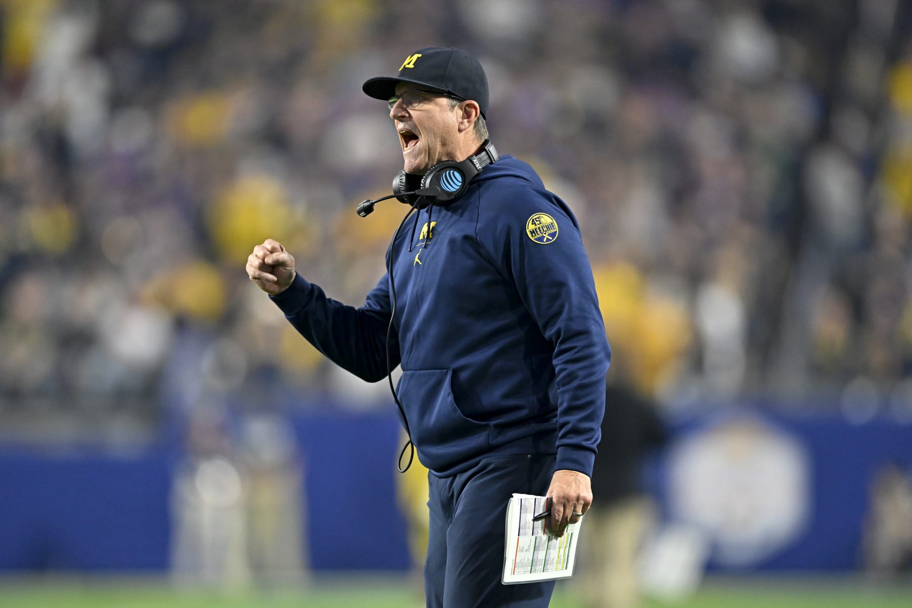 GLENDALE, ARIZONA - DECEMBER 31: Head coach Jim Harbaugh of the Michigan Wolverines gestures during the third quarter of the College Football Playoff Semifinal Fiesta Bowl football game against the TCU Horned Frogs at State Farm Stadium on December 31, 2022 in Glendale, Arizona. The TCU Horned Frogs won 51-45. (Photo by Alika Jenner/Getty Images)