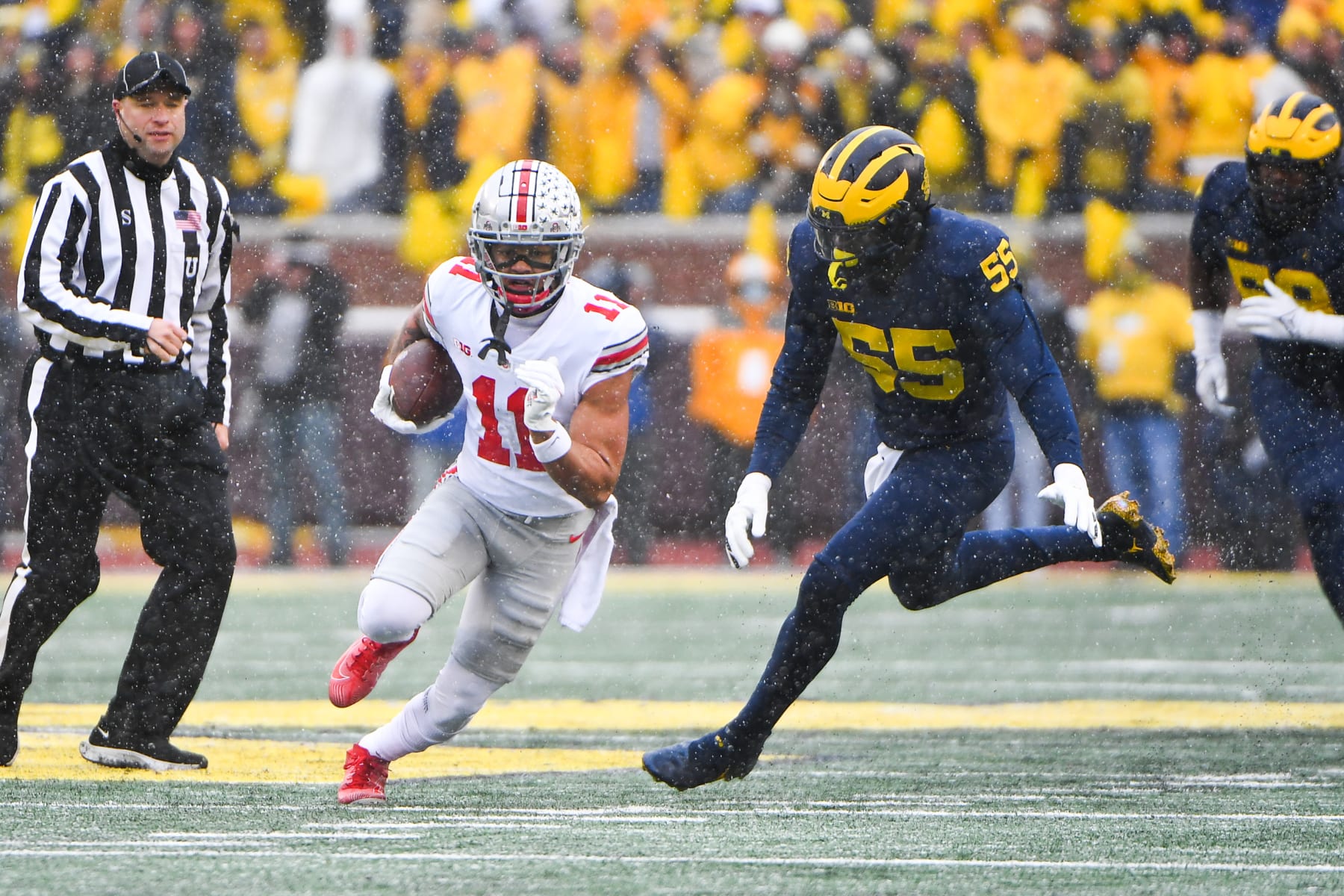 ANN ARBOR, MI - NOVEMBER 27: Ohio State Buckeyes wide receiver Jaxon Smith-Njigba (11) takes a reception for a long gain during The Michigan Wolverines vs the Ohio State Buckeyes game on Saturday November 27, 2021 at Michigan Stadium in Ann Arbor, MI. (Photo by Steven King/Icon Sportswire via Getty Images)