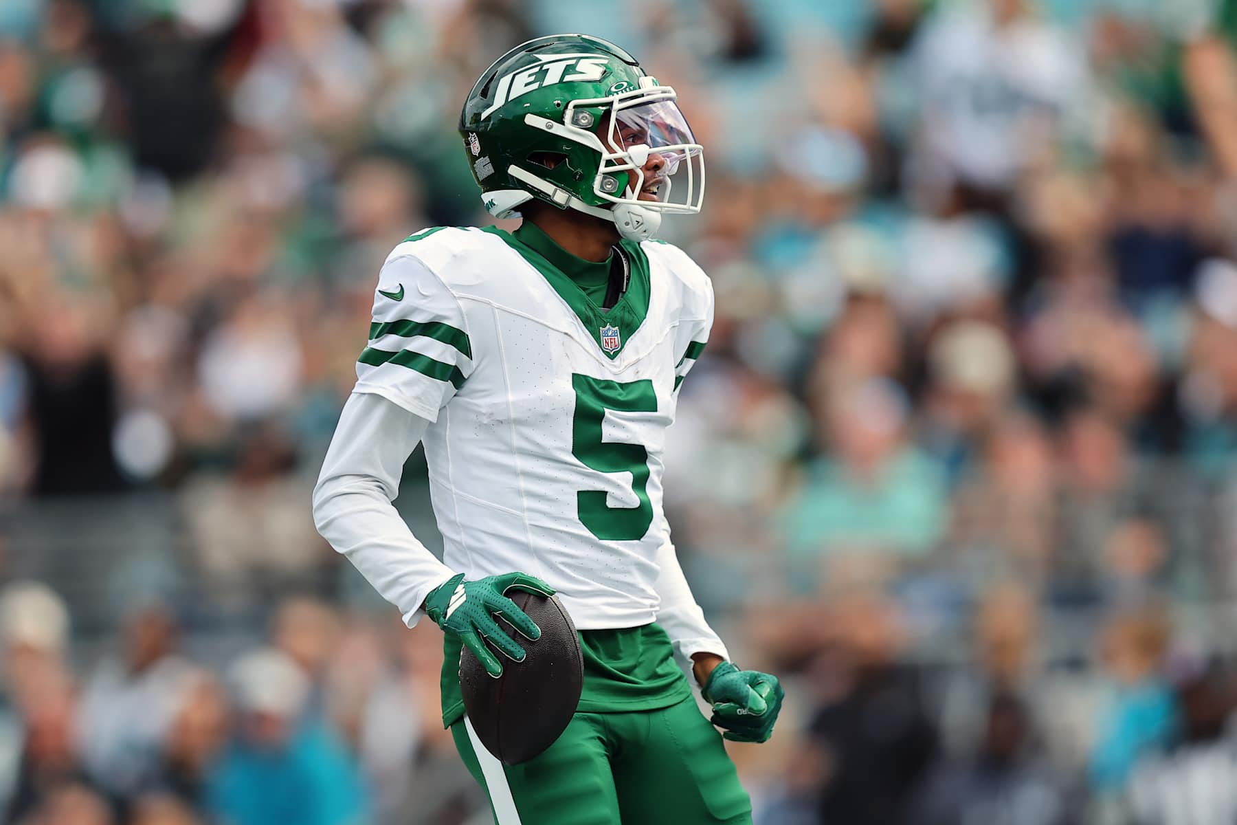 JACKSONVILLE, FLORIDA - DECEMBER 15: Garrett Wilson #5 of the New York Jets celebrates a touchdown against the Jacksonville Jaguars during the first quarter at EverBank Stadium on December 15, 2024 in Jacksonville, Florida. (Photo by Mike Carlson/Getty Images)