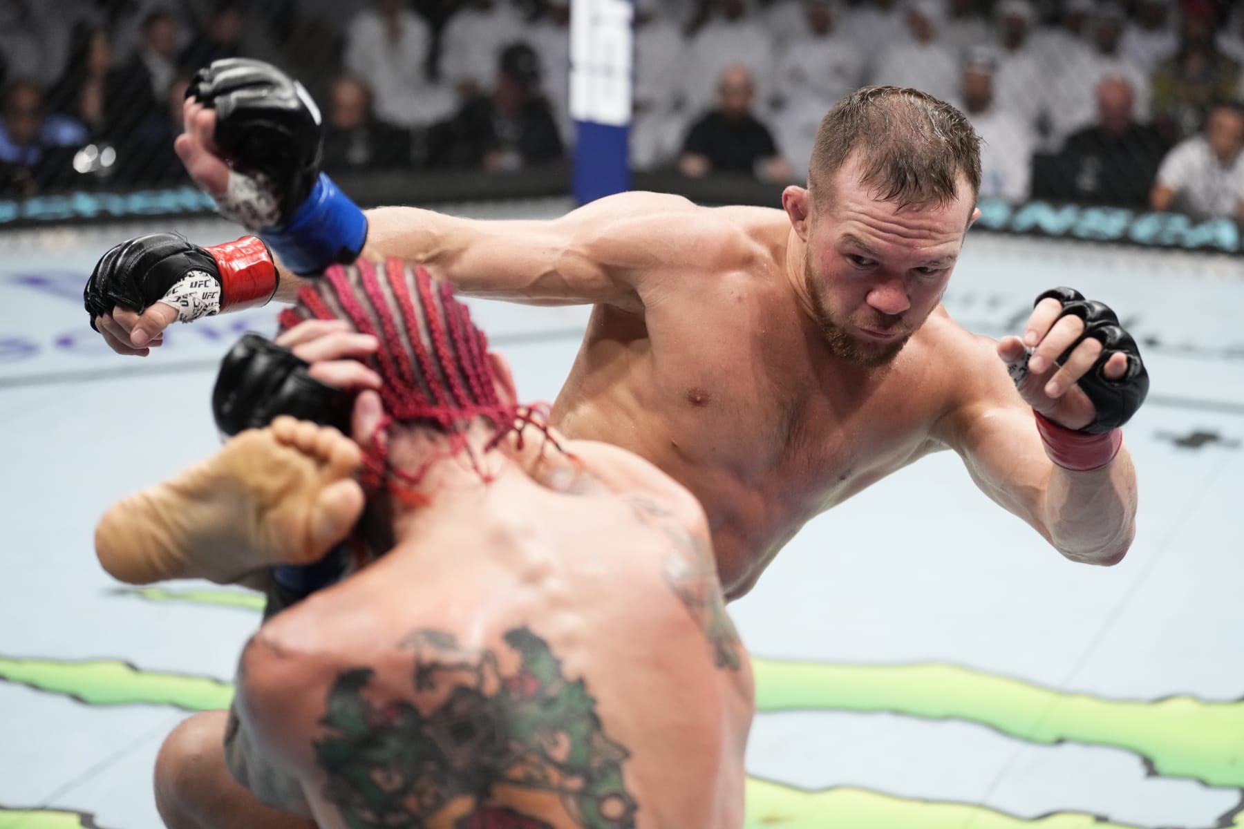 ABU DHABI, UNITED ARAB EMIRATES - OCTOBER 22: (R-L) Petr Yan of Russia kicks Sean O'Malley in a bantamweight fight during the UFC 280 event at Etihad Arena on October 22, 2022 in Abu Dhabi, United Arab Emirates. (Photo by Chris Unger/Zuffa LLC)
