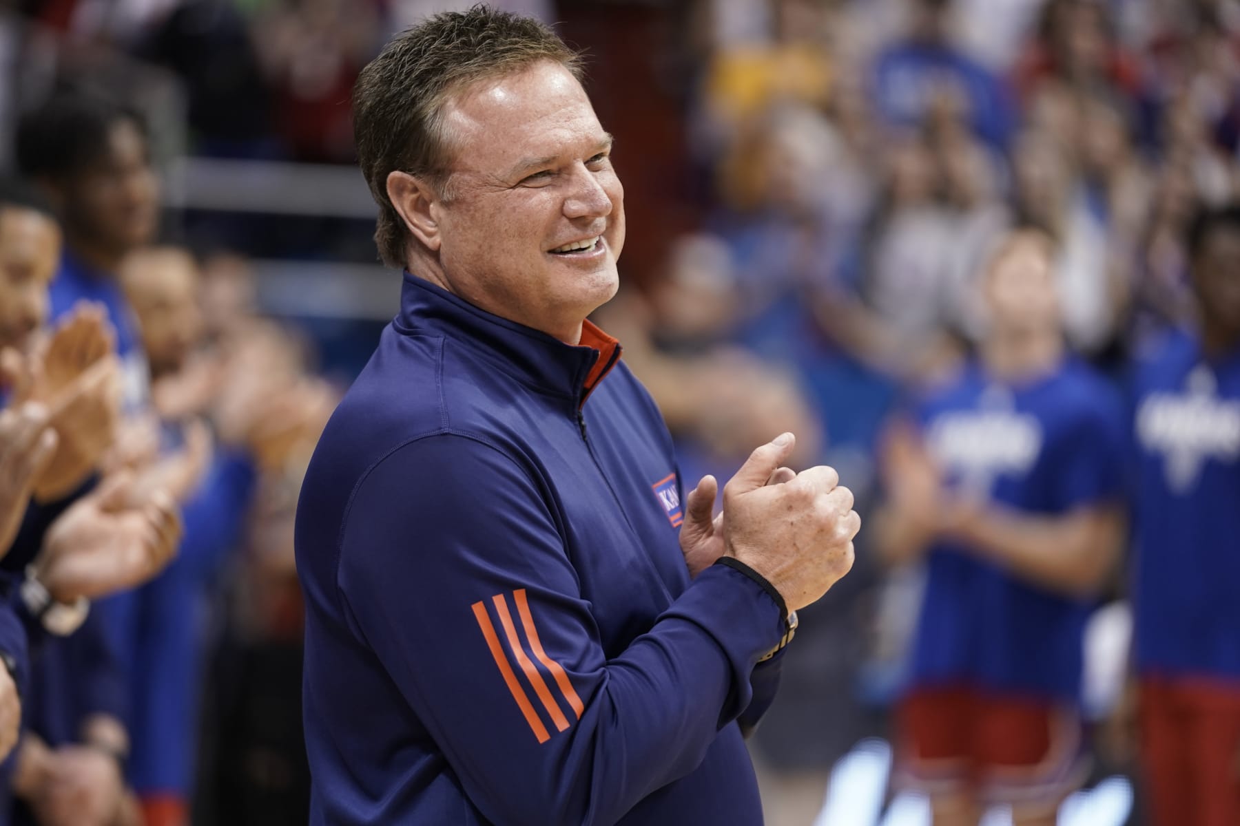 LAWRENCE, KANSAS - FEBRUARY 28:  Head coach Bill Self of the Kansas Jayhawks applauds his team prior to a game against the Texas Tech Red Raiders at Allen Fieldhouse on February 28, 2023 in Lawrence, Kansas. (Photo by Ed Zurga/Getty Images)