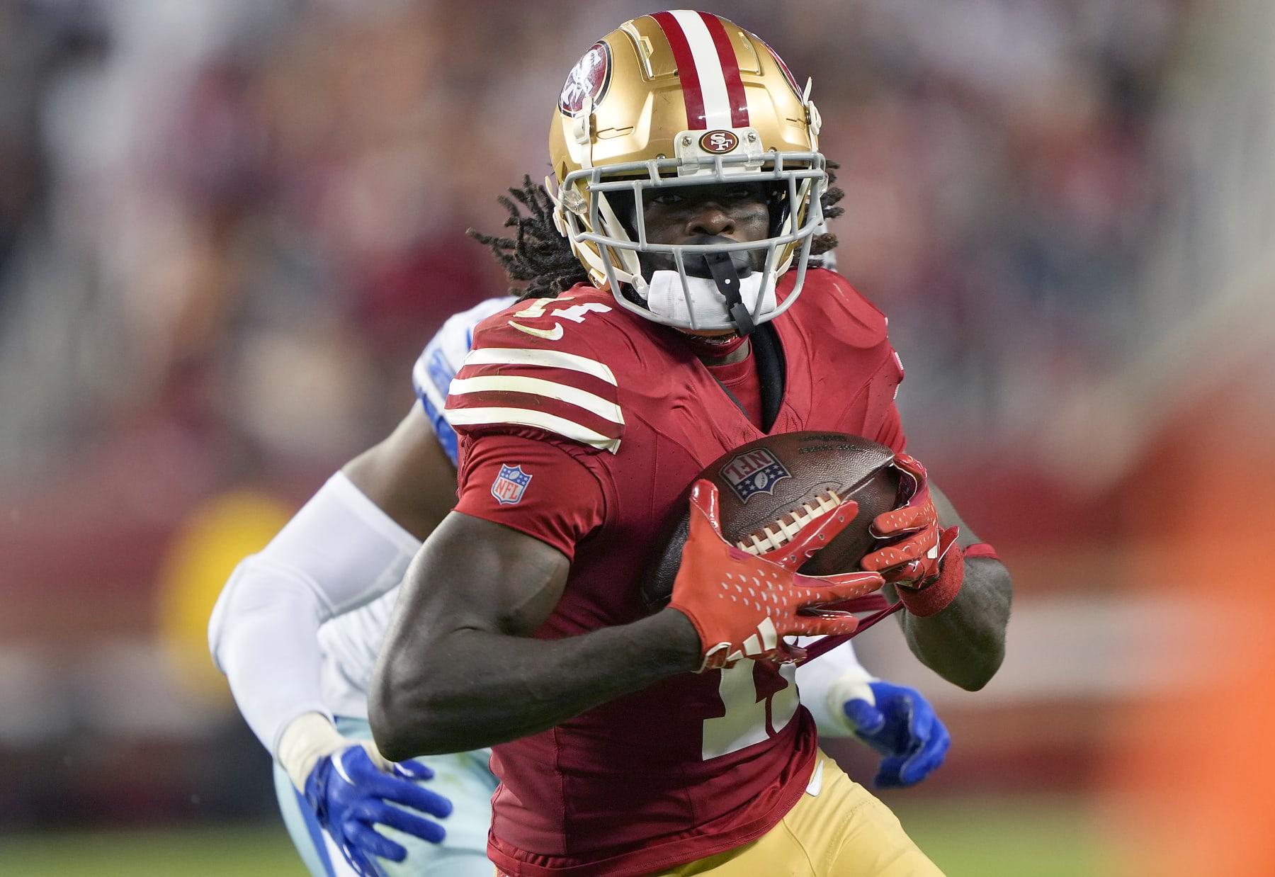 SANTA CLARA, CALIFORNIA - OCTOBER 08: Brandon Aiyuk #11 of the San Francisco 49ers catches a pass over Noah Igbinoghene #19 of the Dallas Cowboys during the third quarter of an NFL football game at Levi's Stadium on October 08, 2023 in Santa Clara, California. (Photo by Thearon W. Henderson/Getty Images)