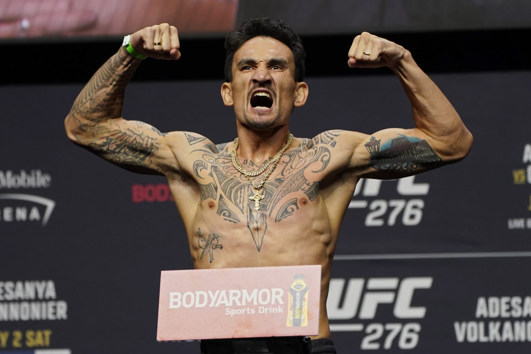 Max Holloway poses during a ceremonial weigh-in for the UFC 276 mixed martial arts event, Friday, July 1, 2022, in Las Vegas. Holloway is scheduled to fight Alexander Volkanovski in a featherweight title bout Saturday in Las Vegas. (AP Photo/John Locher)
