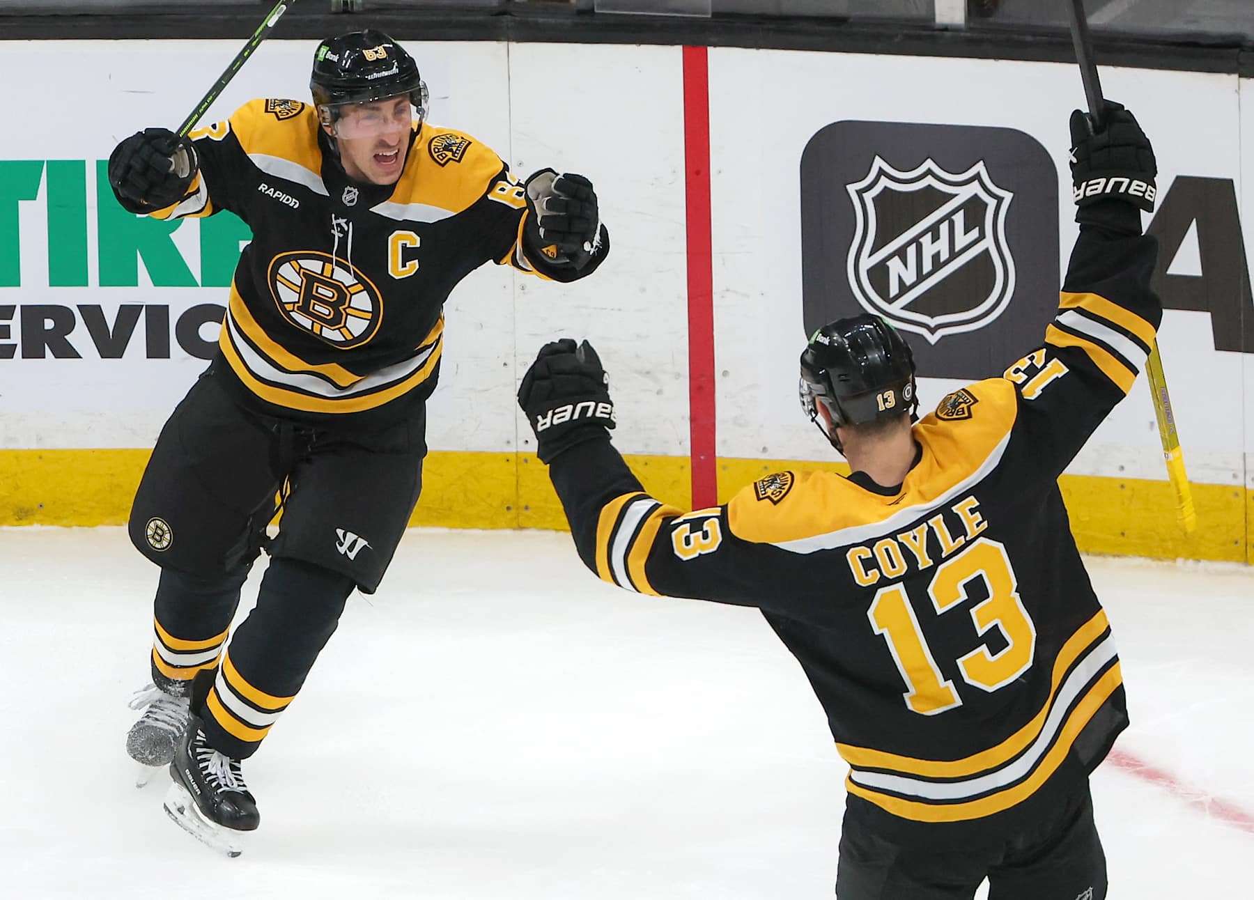 Boston, MA - December 23: Boston Bruins C Charlie Coyle celebrates his goal with teammate Brad Marchand in the third period. (Photo by Matthew J. Lee/The Boston Globe via Getty Images)