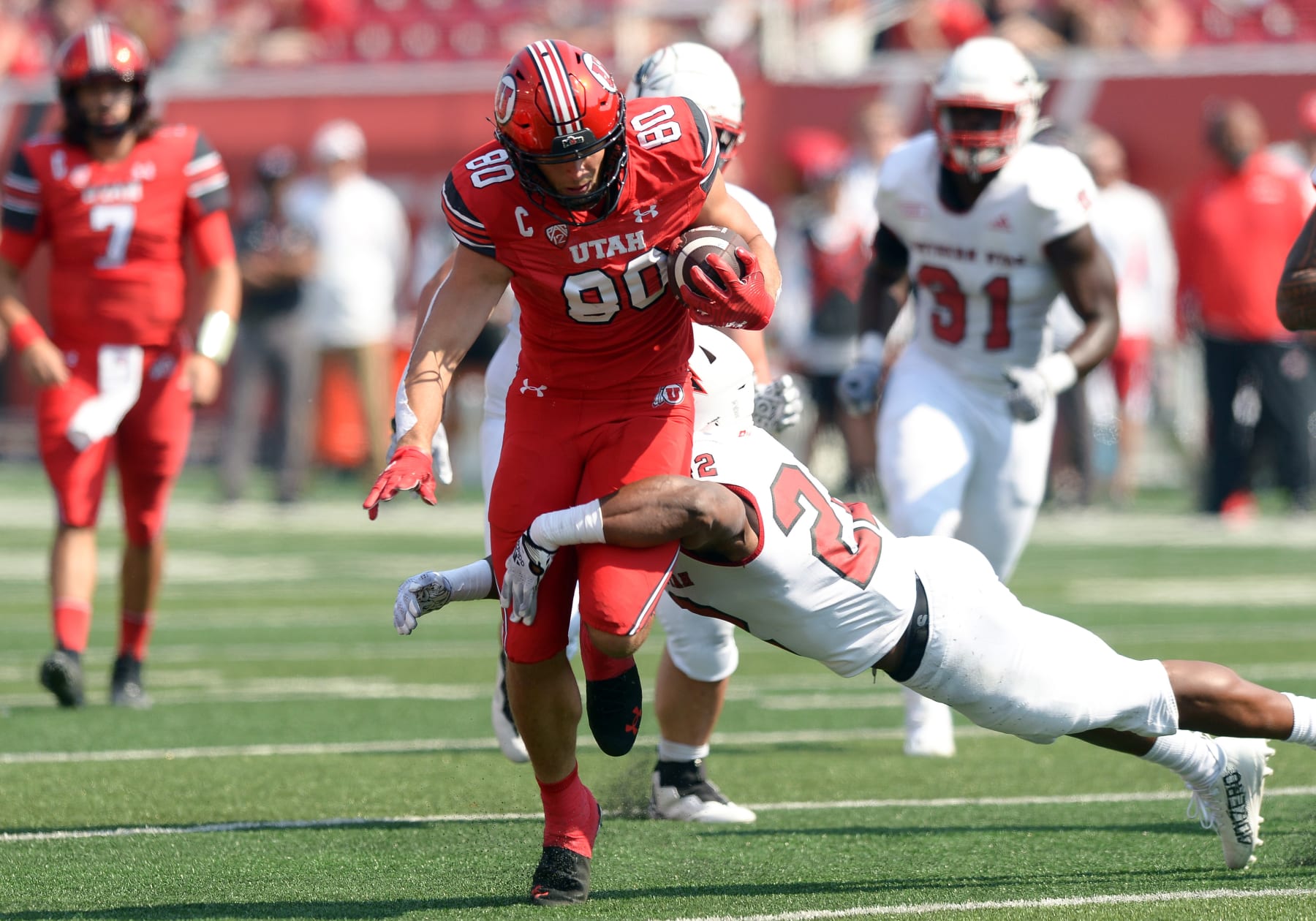 SALT LAKE CITY, UT - SEPTEMBER 10: Utah Utes tight end Brant Kuithe (80) tries to break a tackle from Southern Utah Thunderbirds running back Jordan Jefferson (22) during a game between Southern Utah Thunderbirds and the University of Utah Utes  on September 10, 2022, at Rice-Eccles Stadium in Salt Lake City, Utah. (Photo by Boyd Ivey/Icon Sportswire via Getty Images)
