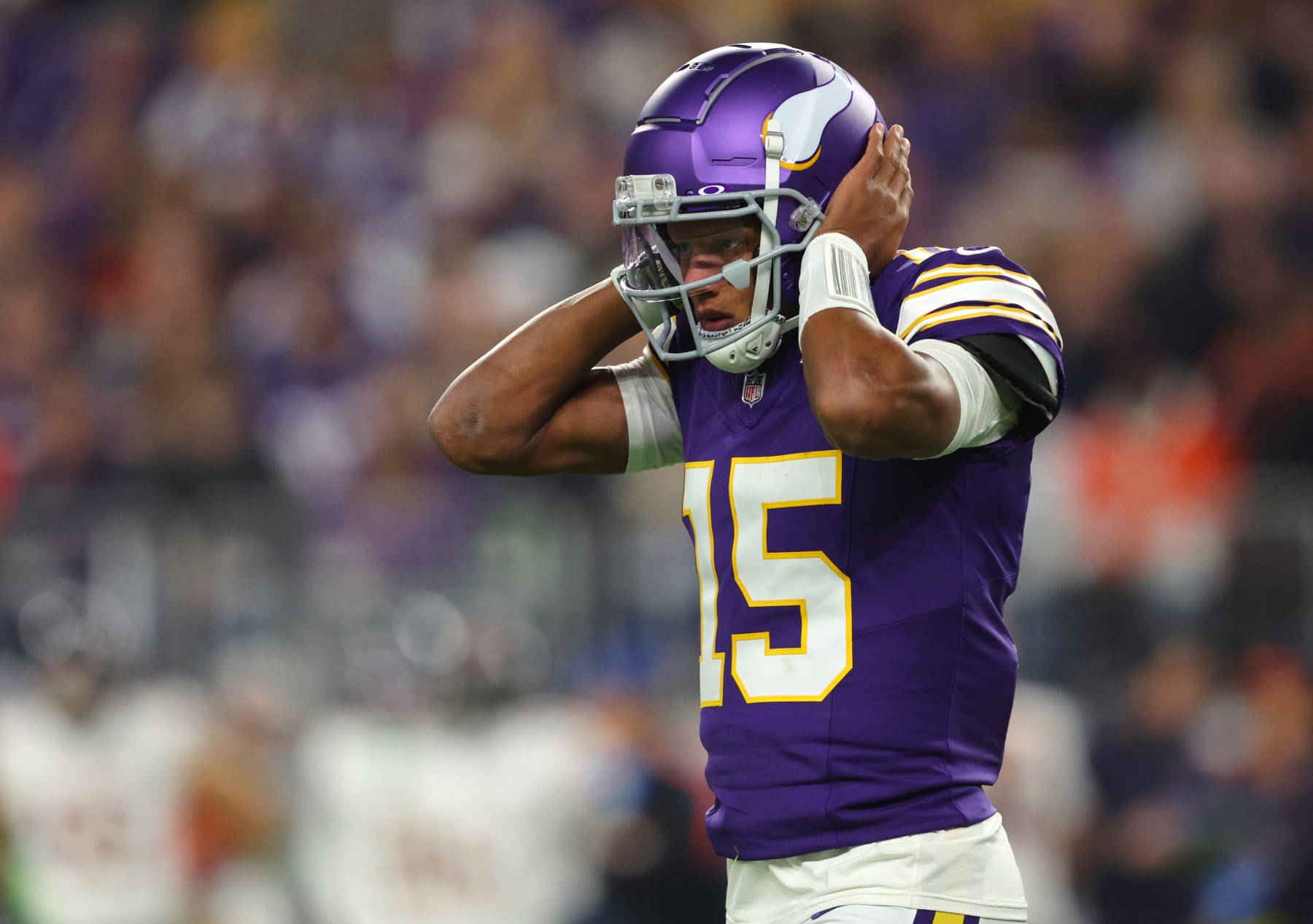 MINNEAPOLIS, MINNESOTA - NOVEMBER 27: Joshua Dobbs #15 of the Minnesota Vikings listens for a play call during the second quarter against the Chicago Bears at U.S. Bank Stadium on November 27, 2023 in Minneapolis, Minnesota. (Photo by Adam Bettcher/Getty Images)