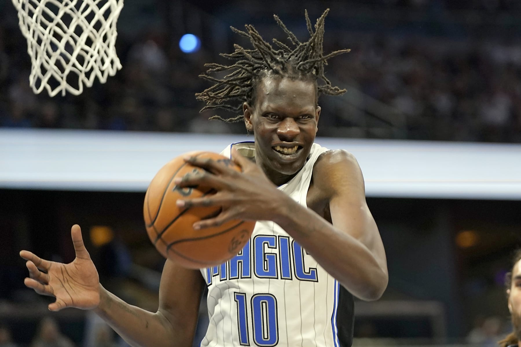 Orlando Magic's Bol Bol (10) grabs a rebound during the second half of an NBA preseason basketball game against the Memphis Grizzlies, Tuesday, Oct. 11, 2022, in Orlando, Fla. (AP Photo/John Raoux)