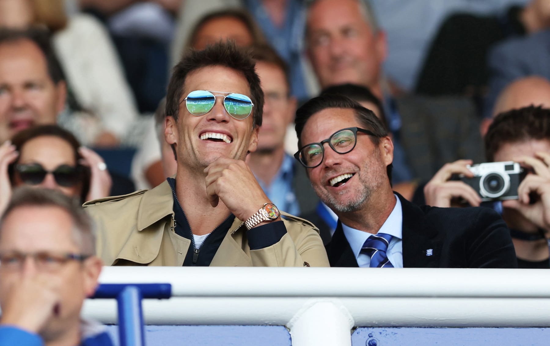 BIRMINGHAM, ENGLAND - AUGUST 12: Tom Brady, Birmingham City co-owner and Matt Alvarez, Director interact in the stands during the Sky Bet Championship match between Birmingham City and Leeds United at St Andrews (stadium) on August 12, 2023 in Birmingham, England. (Photo by Cameron Smith/Getty Images)
