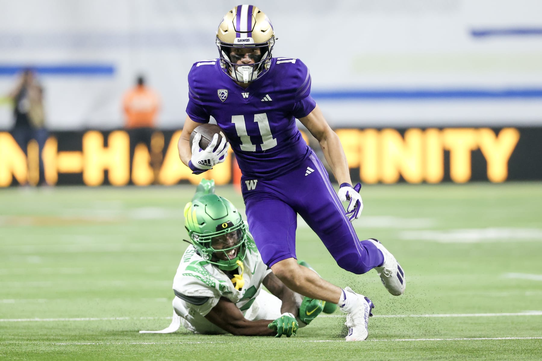 LAS VEGAS, NEVADA - DECEMBER 01: Jalen McMillan #11 of the Washington Huskies runs past Khyree Jackson #5 of the Oregon Ducks during the second quarter during the Pac-12 Championship at Allegiant Stadium on December 01, 2023 in Las Vegas, Nevada. (Photo by Ian Maule/Getty Images)