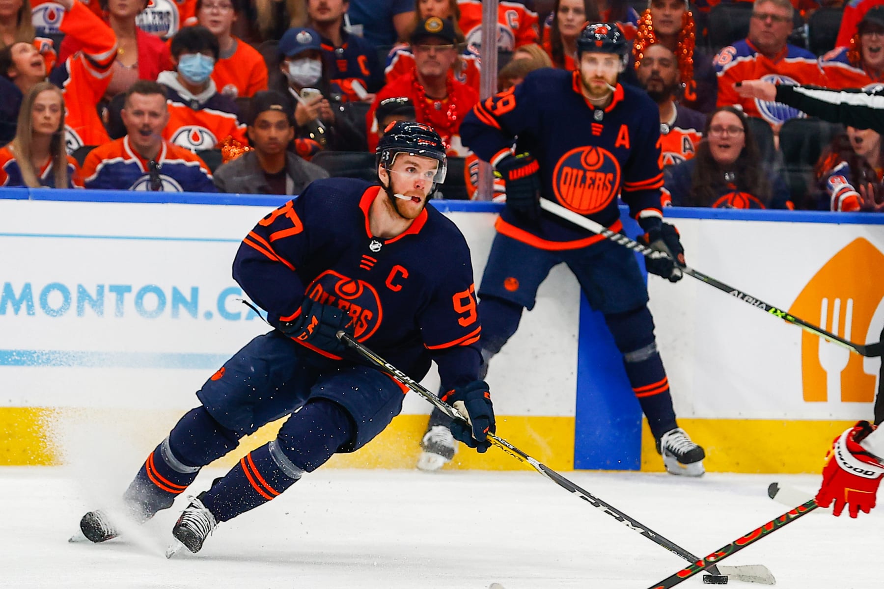 EDMONTON, AB - MAY 22: Edmonton Oilers Center Connor McDavid (97) and Edmonton Oilers Center Leon Draisaitl (29) in power play action in the first period during the Edmonton Oilers versus the Calgary Flames in the Stanley Cup playoffs round 2, game 3 on May 22, 2022 at Rogers Place in Edmonton, AB. (Photo by Curtis Comeau/Icon Sportswire via Getty Images)