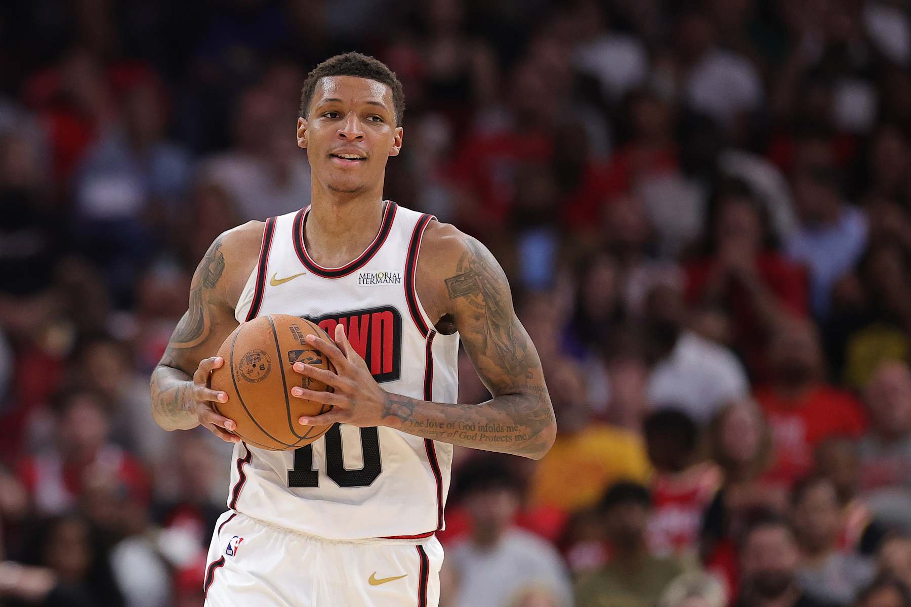 HOUSTON, TEXAS - DECEMBER 27: Jabari Smith Jr. #10 of the Houston Rockets handles the ball against the Minnesota Timberwolves during the first half at Toyota Center on December 27, 2024 in Houston, Texas. NOTE TO USER: User expressly acknowledges and agrees that, by downloading and or using this photograph, User is consenting to the terms and conditions of the Getty Images License Agreement.  (Photo by Alex Slitz/Getty Images)