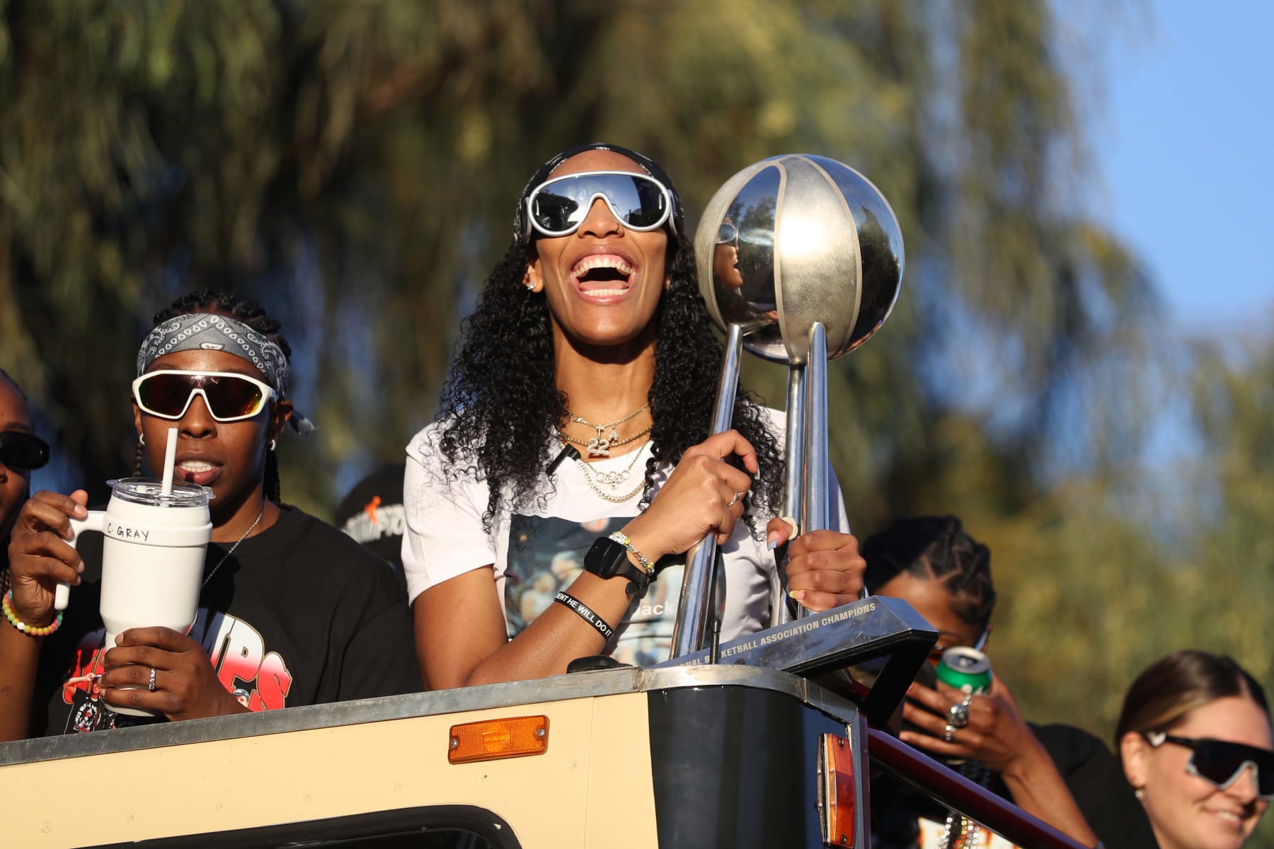 LAS VEGAS, NEVADA - OCTOBER 23: A'ja Wilson #22 of the Las Vegas Aces celebrates during the 2023 WNBA championship victory parade and rally on the Las Vegas Strip on October 23, 2023 in Las Vegas, Nevada. NOTE TO USER: User expressly acknowledges and agrees that, by downloading and or using this photograph, User is consenting to the terms and conditions of the Getty Images License Agreement. (Photo by Ian Maule/NBAE via Getty Images)