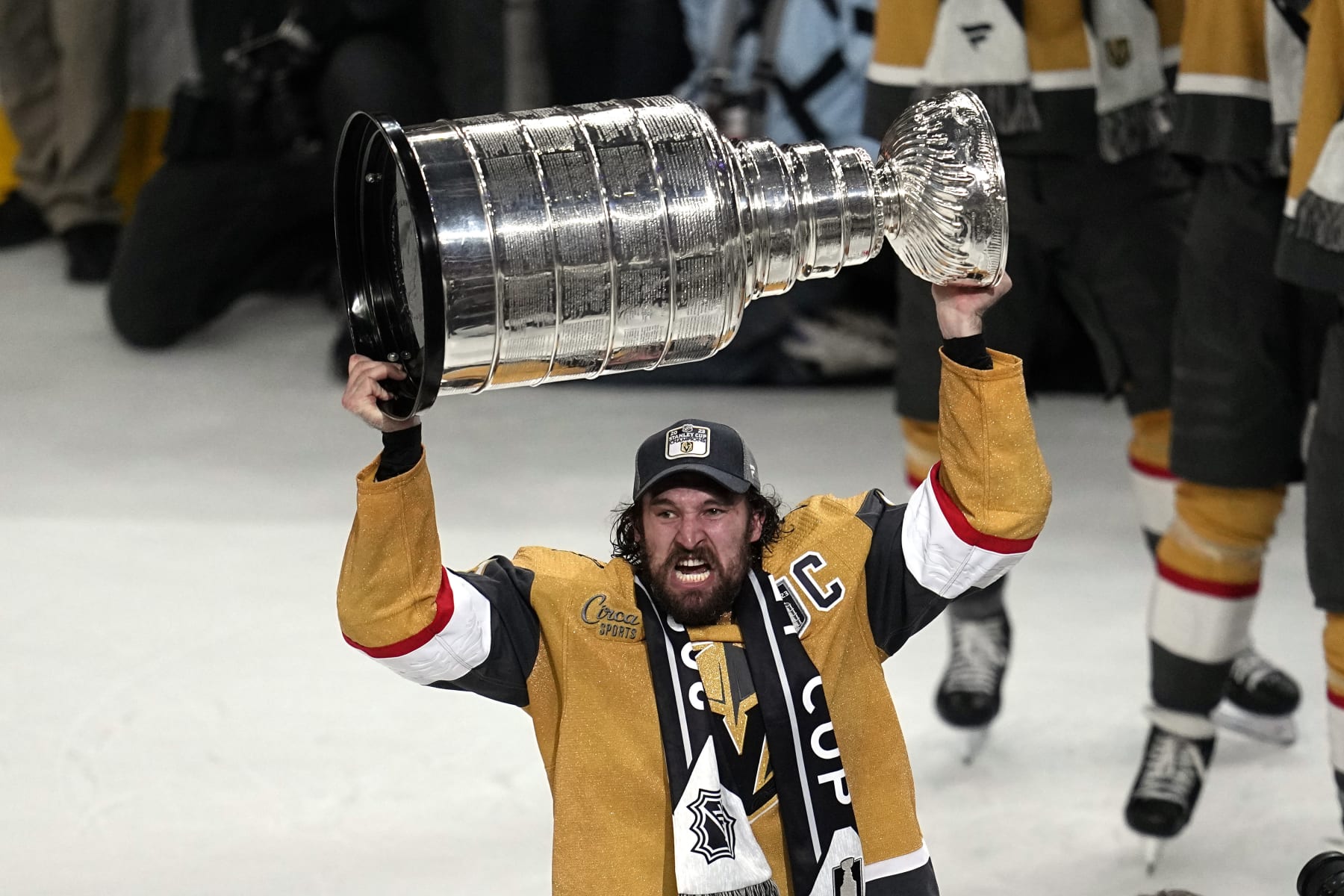 Vegas Golden Knights right wing Mark Stone skates with the Stanley Cup after the Knights defeated the Florida Panthers 9-3 in Game 5 of the NHL hockey Stanley Cup Finals Tuesday, June 13, 2023, in Las Vegas. The Knights won the series 4-1. (AP Photo/Abbie Parr)