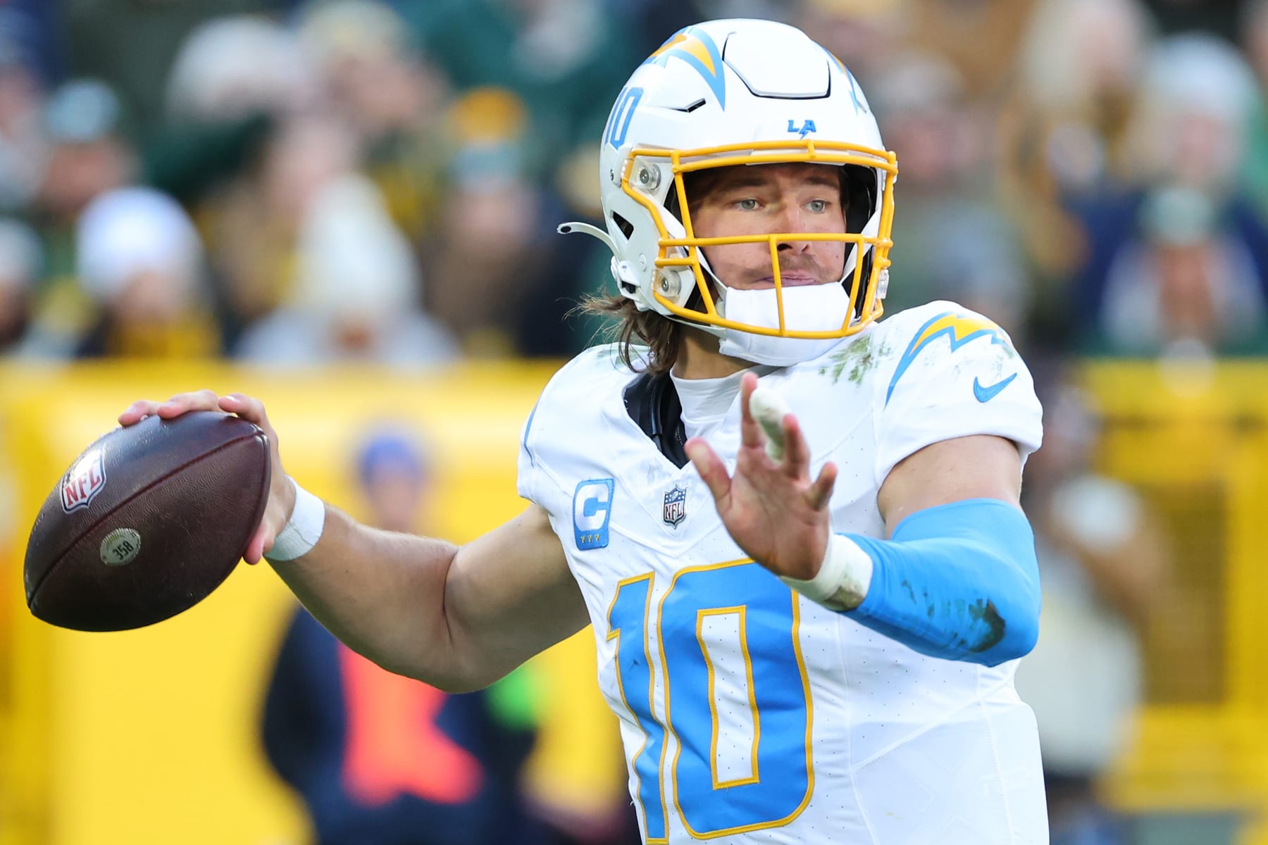 GREEN BAY, WISCONSIN - NOVEMBER 19: Justin Herbert #10 of the Los Angeles Chargers drops back to pass during a game against the Green Bay Packers at Lambeau Field on November 19, 2023 in Green Bay, Wisconsin. The Packers defeated the Chargers 23-20. (Photo by Stacy Revere/Getty Images)