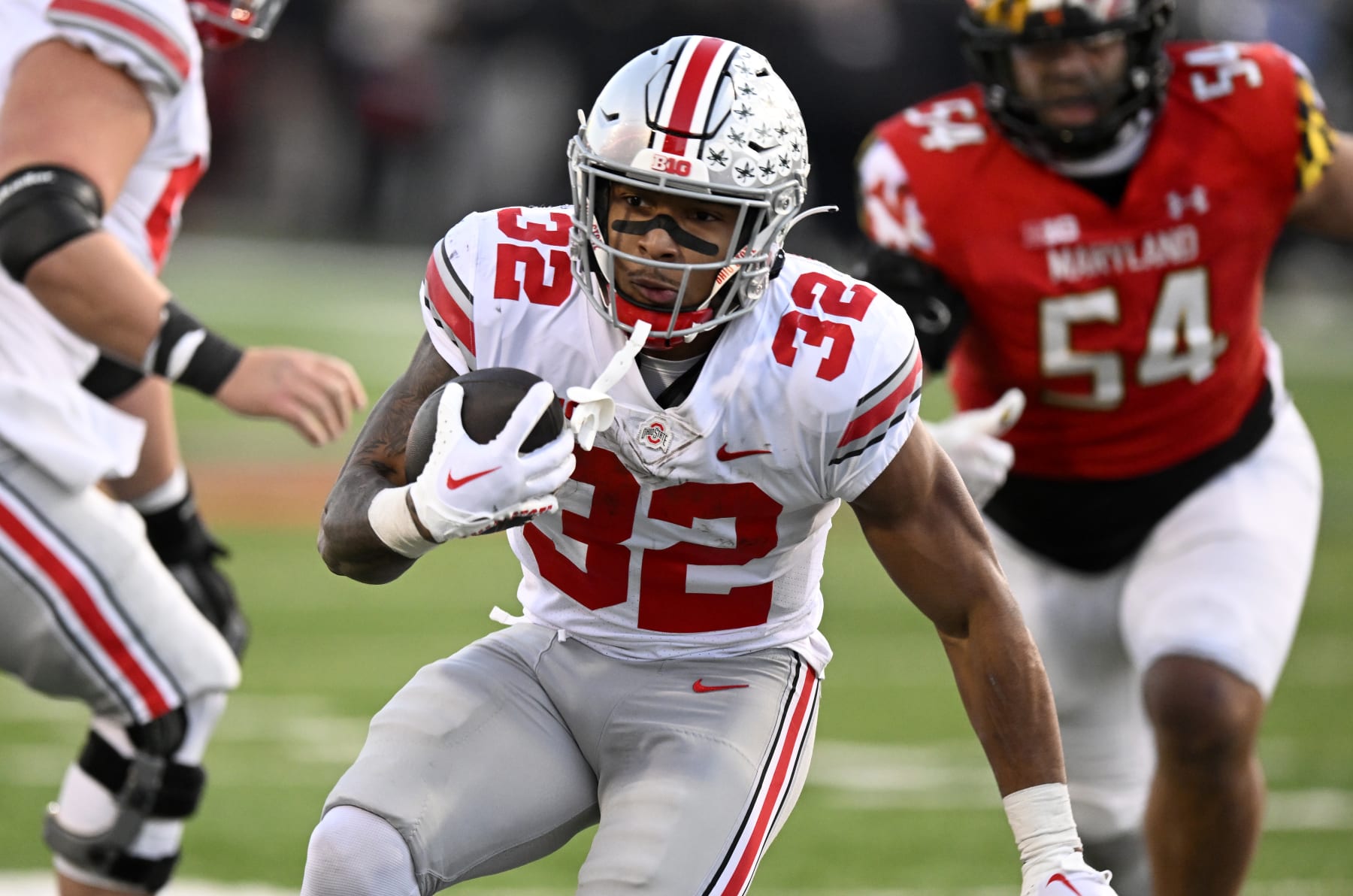 COLLEGE PARK, MARYLAND - NOVEMBER 19: TreVeyon Henderson #32 of the Ohio State Buckeyes runs the ball against the Maryland Terrapins at SECU Stadium on November 19, 2022 in College Park, Maryland. (Photo by G Fiume/Getty Images)