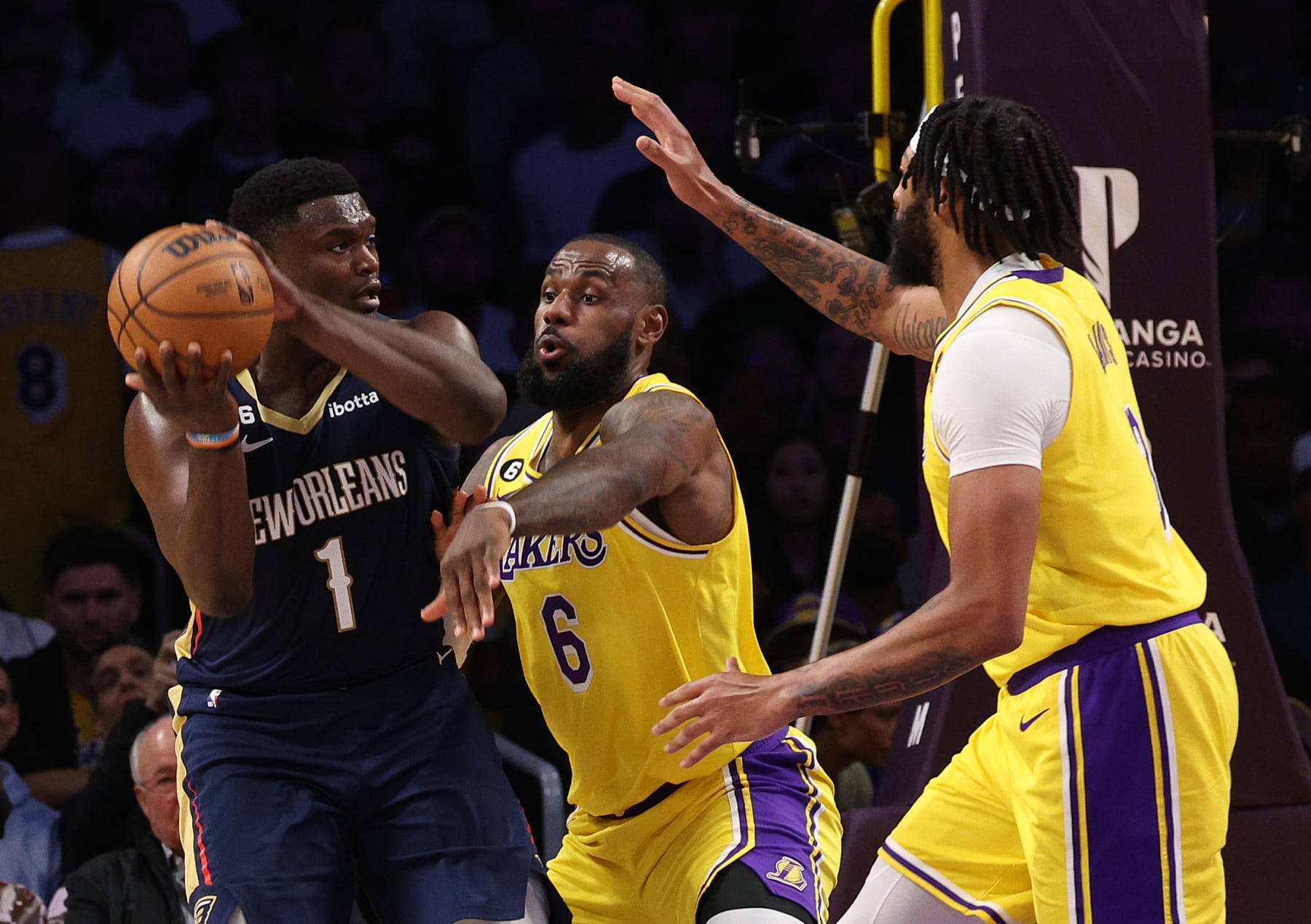 LOS ANGELES, CALIFORNIA - NOVEMBER 02: Zion Williamson #1 of the New Orleans Pelicans tries to pass in front of LeBron James #6 and Anthony Davis #3 of the Los Angeles Lakers during the first half at Crypto.com Arena on November 02, 2022 in Los Angeles, California. NOTE TO USER: User expressly acknowledges and agrees that, by downloading and/or using this Photograph, user is consenting to the terms and conditions of the Getty Images License Agreement. Mandatory Copyright Notice: Copyright 2022 NBAE (Photo by Harry How/Getty Images)
