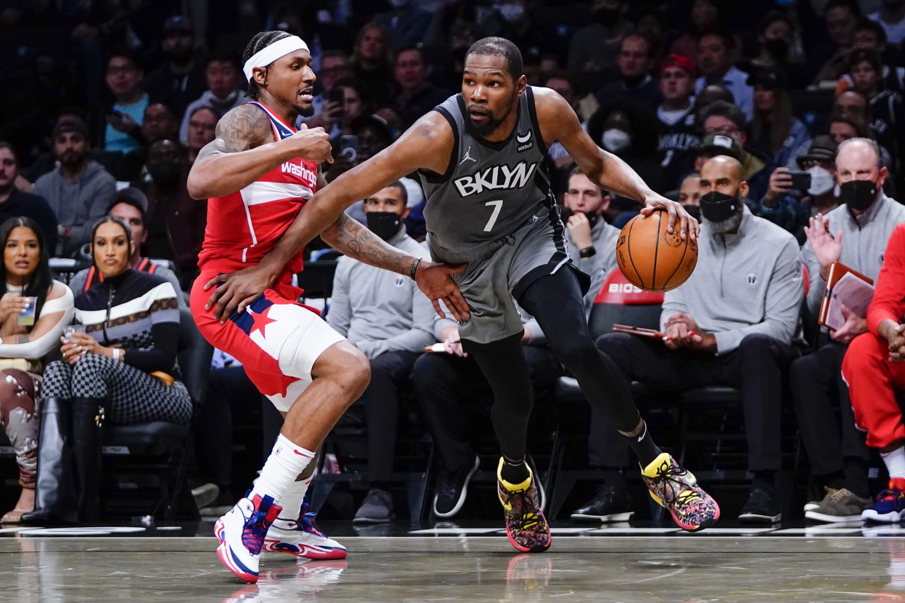 Brooklyn Nets' Kevin Durant (7) drives past Washington Wizards' Bradley Beal (3) during the second half of an NBA basketball game Monday, Oct. 25, 2021, in New York. The Nets won 104-90. (AP Photo/Frank Franklin II)