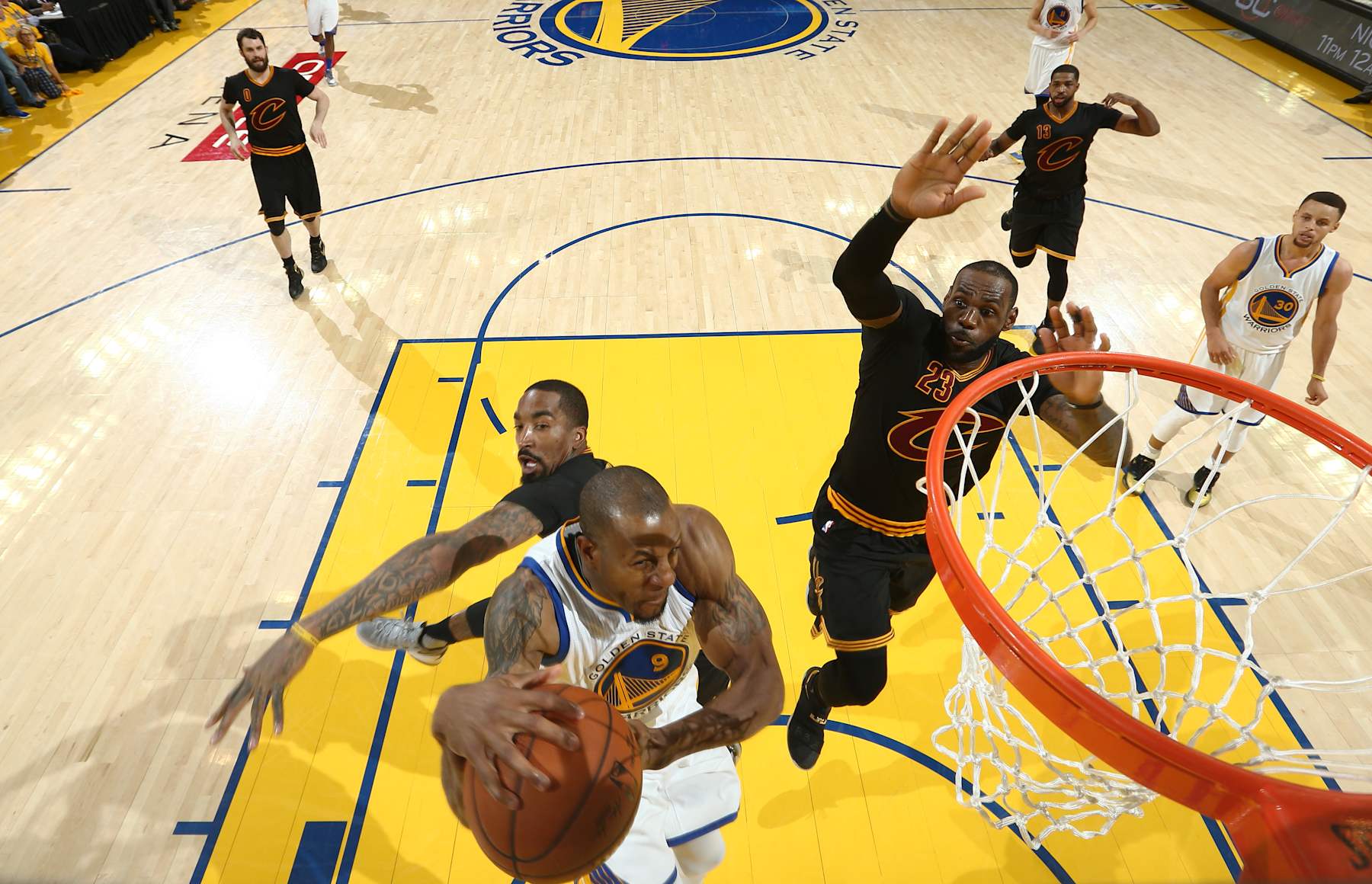 OAKLAND, CA - JUNE 19:  LeBron James #23 of the Cleveland Cavaliers blocks a shot by Andre Iguodala #9 of the Golden State Warriors in Game Seven of the 2016 NBA Finals on June 19, 2016 at Oracle Arena in Oakland, California. NOTE TO USER: User expressly acknowledges and agrees that, by downloading and or using this photograph, user is consenting to the terms and conditions of Getty Images License Agreement. Mandatory Copyright Notice: Copyright 2016 NBAE (Photo by Nathaniel S. Butler/NBAE via Getty Images)