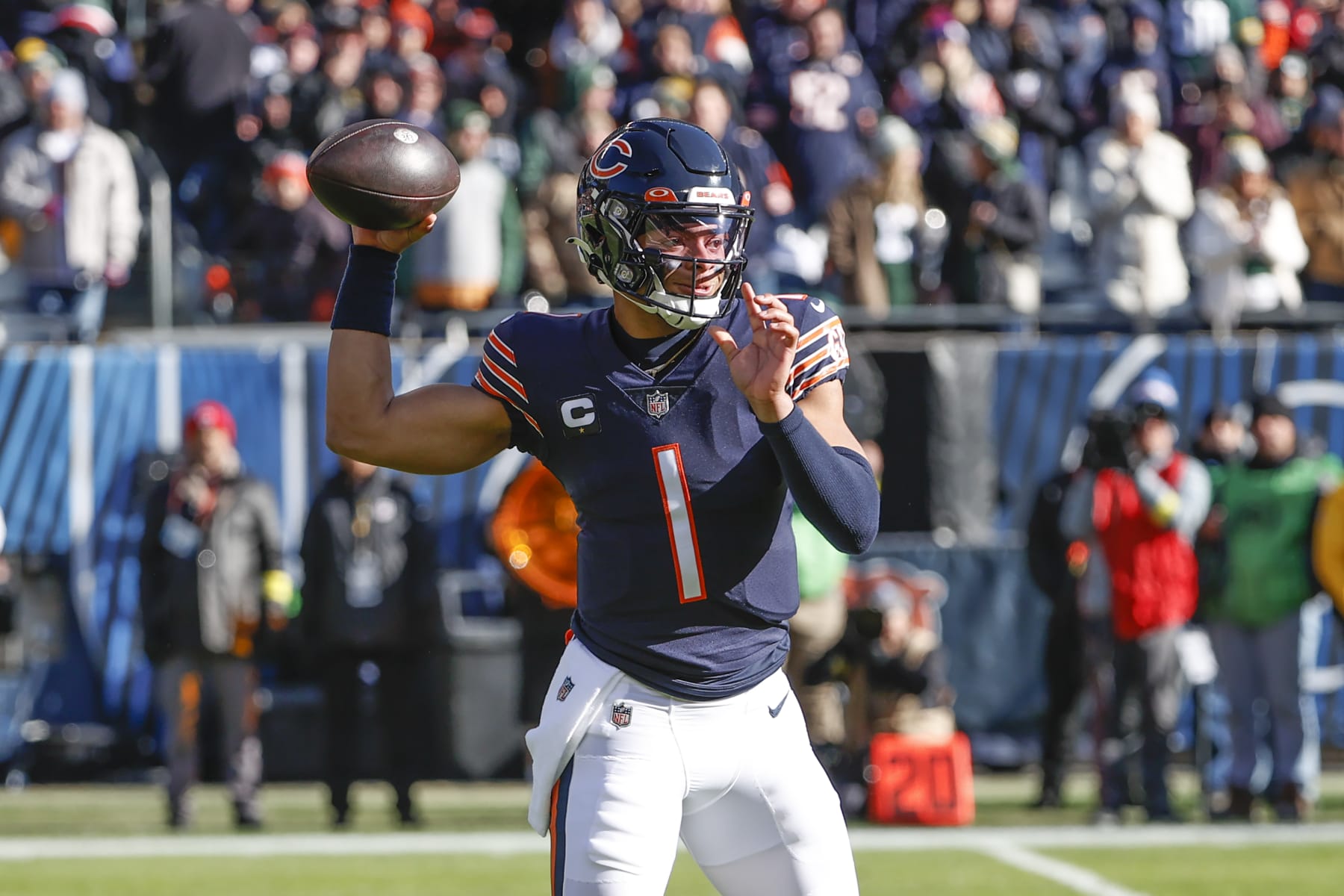Chicago Bears quarterback Justin Fields (1) passes the ball against the Green Bay Packers during the first half of an NFL football game, Sunday, Dec. 4, 2022, in Chicago. (AP Photo/Kamil Krzaczynski)