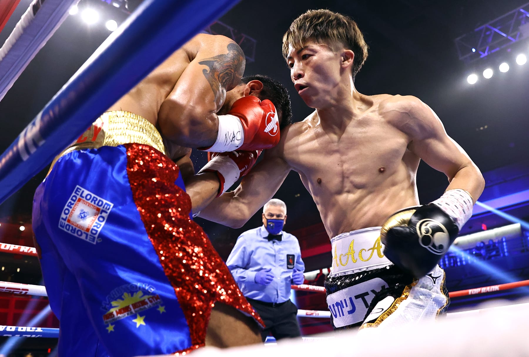 LAS VEGAS, NEVADA - JUNE 19: Naoya Inoue (R) and Michael Dasmarinas (L) exchange punches during their fight for the WBA/IBF bantamweight championship at Virgin Hotels Las Vegas on June 19, 2021 in Las Vegas, Nevada. (Photo by Mikey Williams/Top Rank Inc via Getty Images)