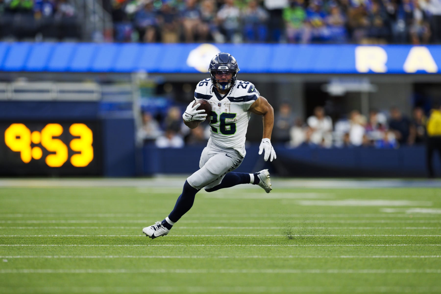 INGLEWOOD, CALIFORNIA - NOVEMBER 19: Zach Charbonnet #26 of the Seattle Seahawks runs with the ball during a game against the Los Angeles Rams at SoFi Stadium on November 19, 2023 in Inglewood, California. (Photo by Ric Tapia/Getty Images)